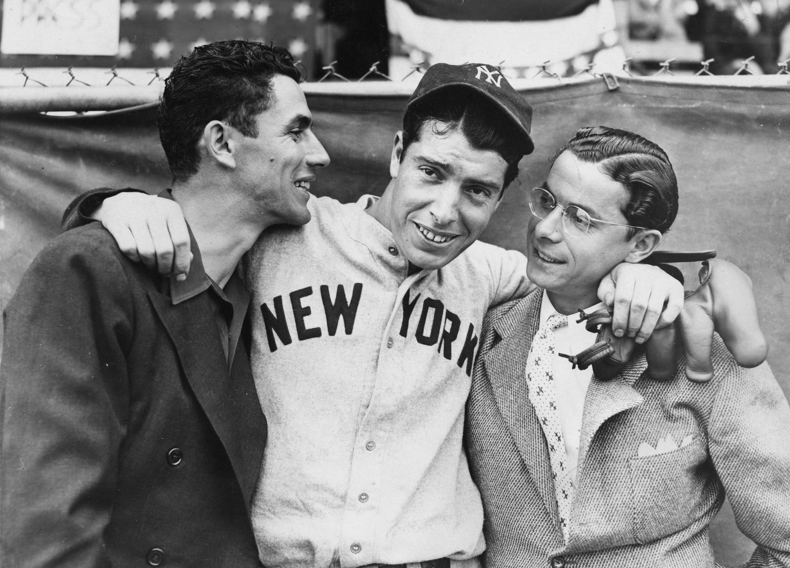 Rookie Joe DiMaggio, center, hugs his brothers Vince, left, and Dom, before the start of the 1936 World Series in New York in October.