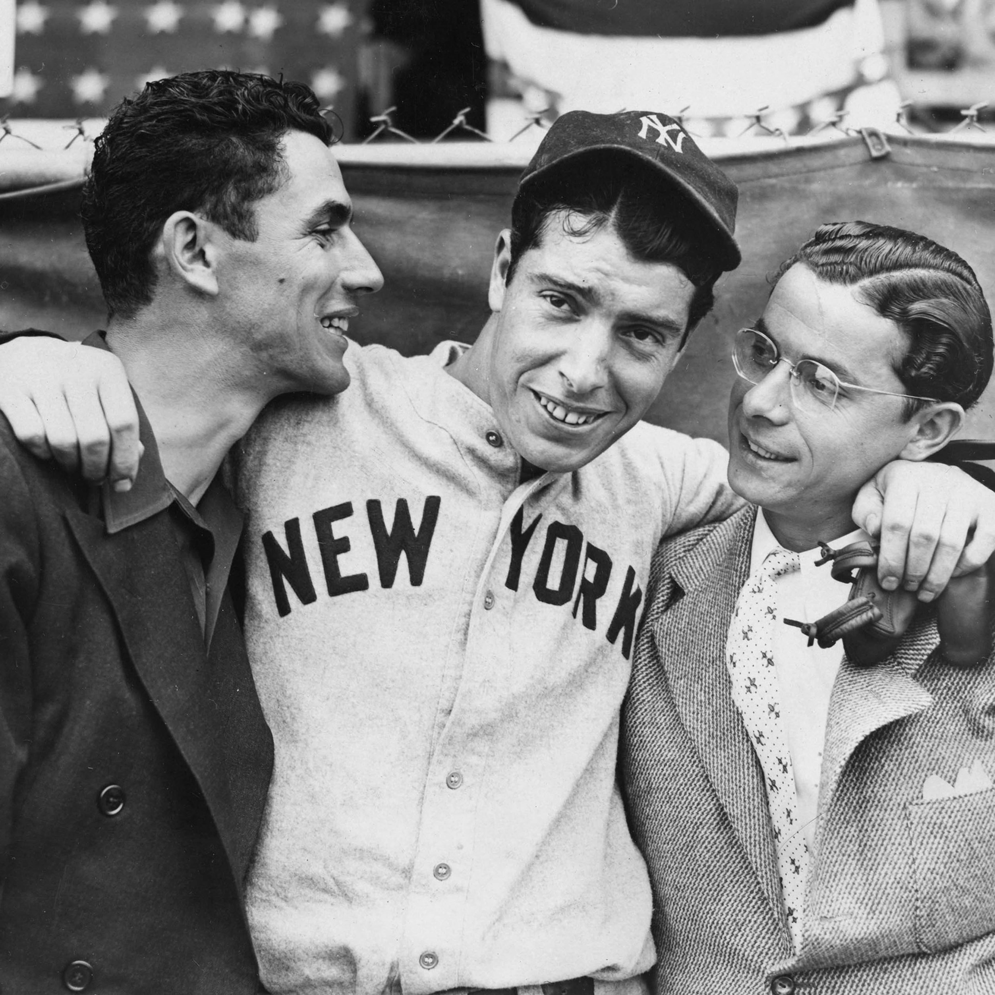 Rookie Joe DiMaggio, center, hugs his brothers Vince, left, and Dom, before the start of the 1936 World Series in New York in October.
