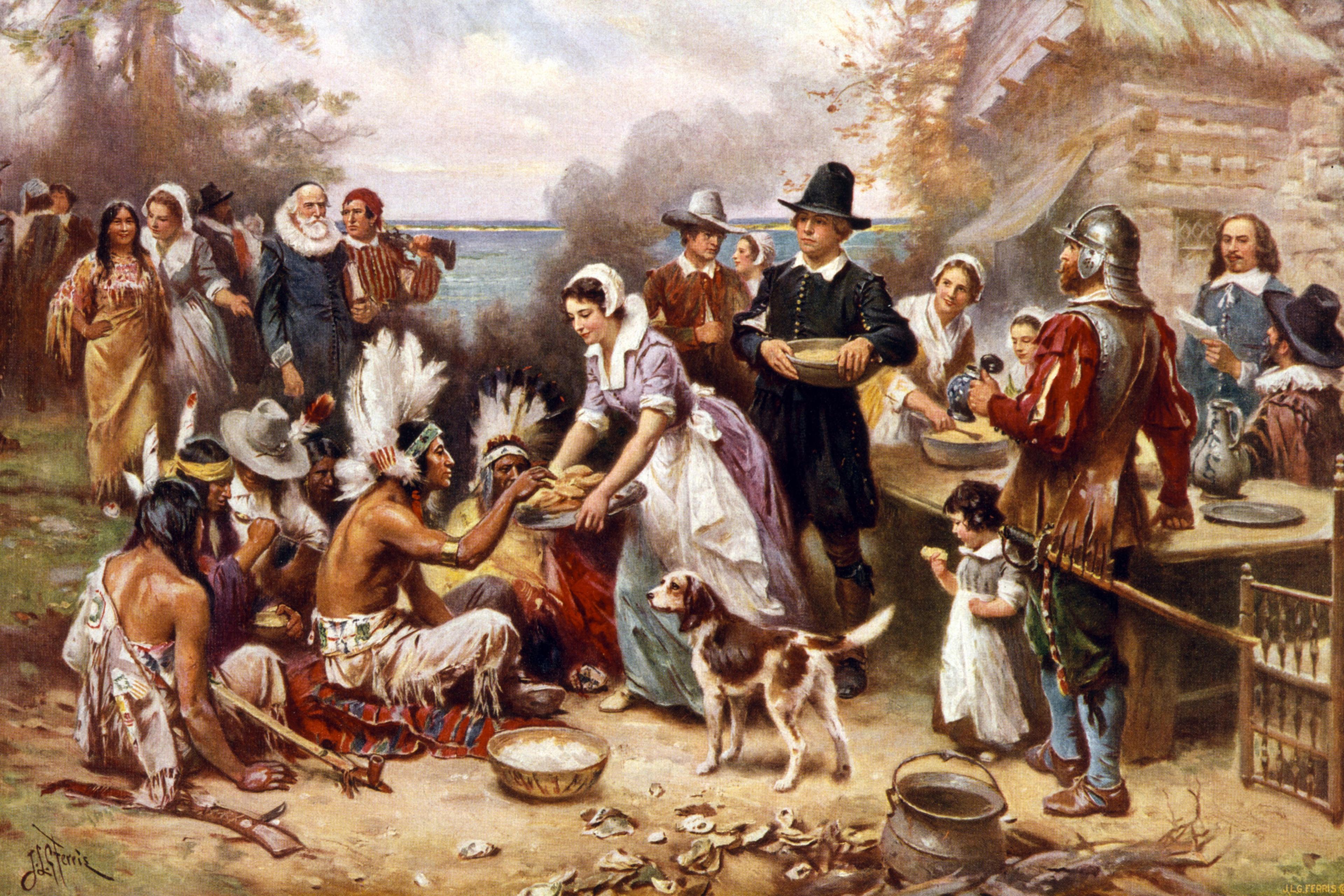 The first Thanksgiving 1621 . Pilgrims and Natives gather to share meal.