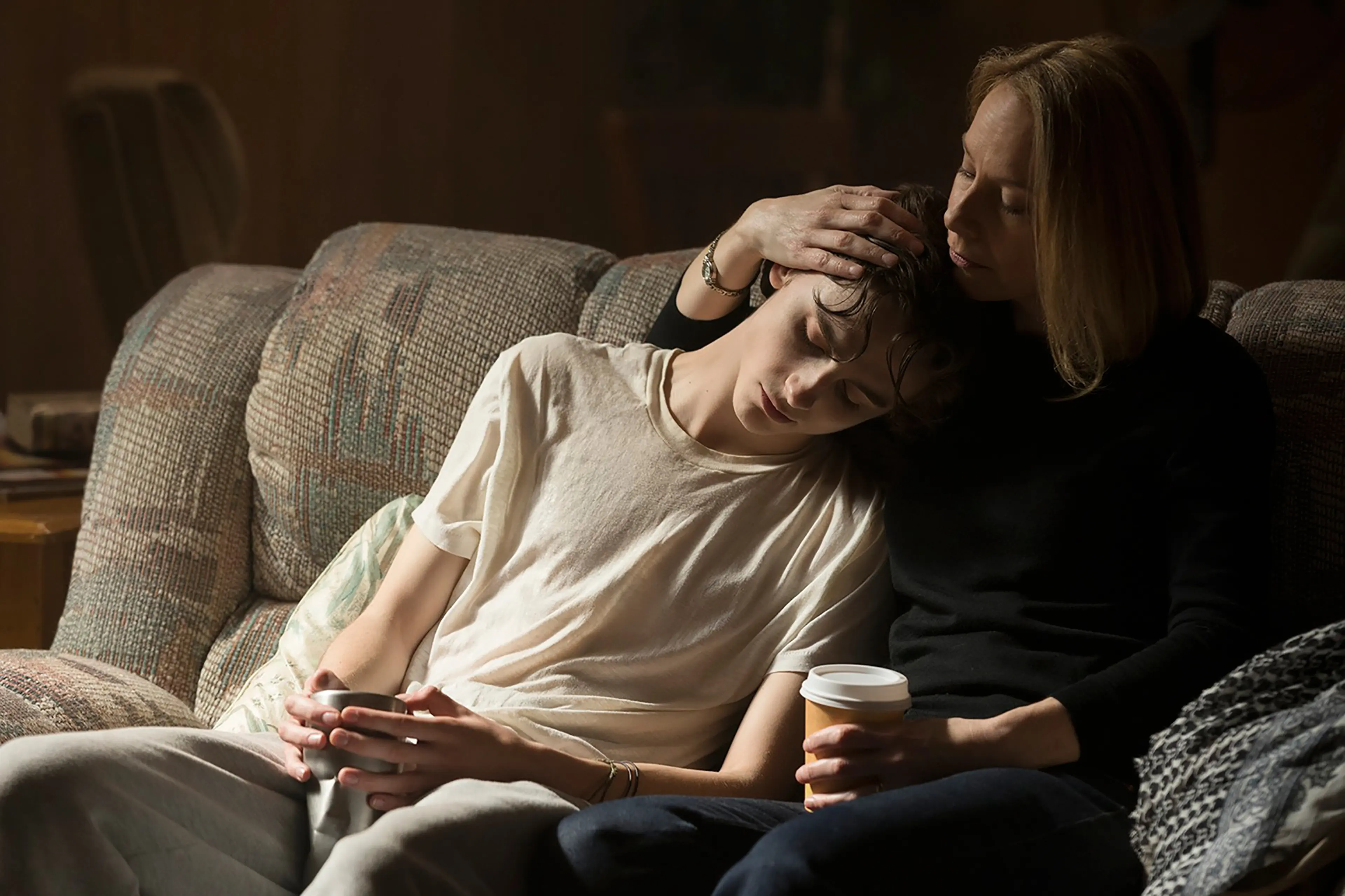 Nic (Timothée Chalamet) is consoled by his mother (Amy Ryan)