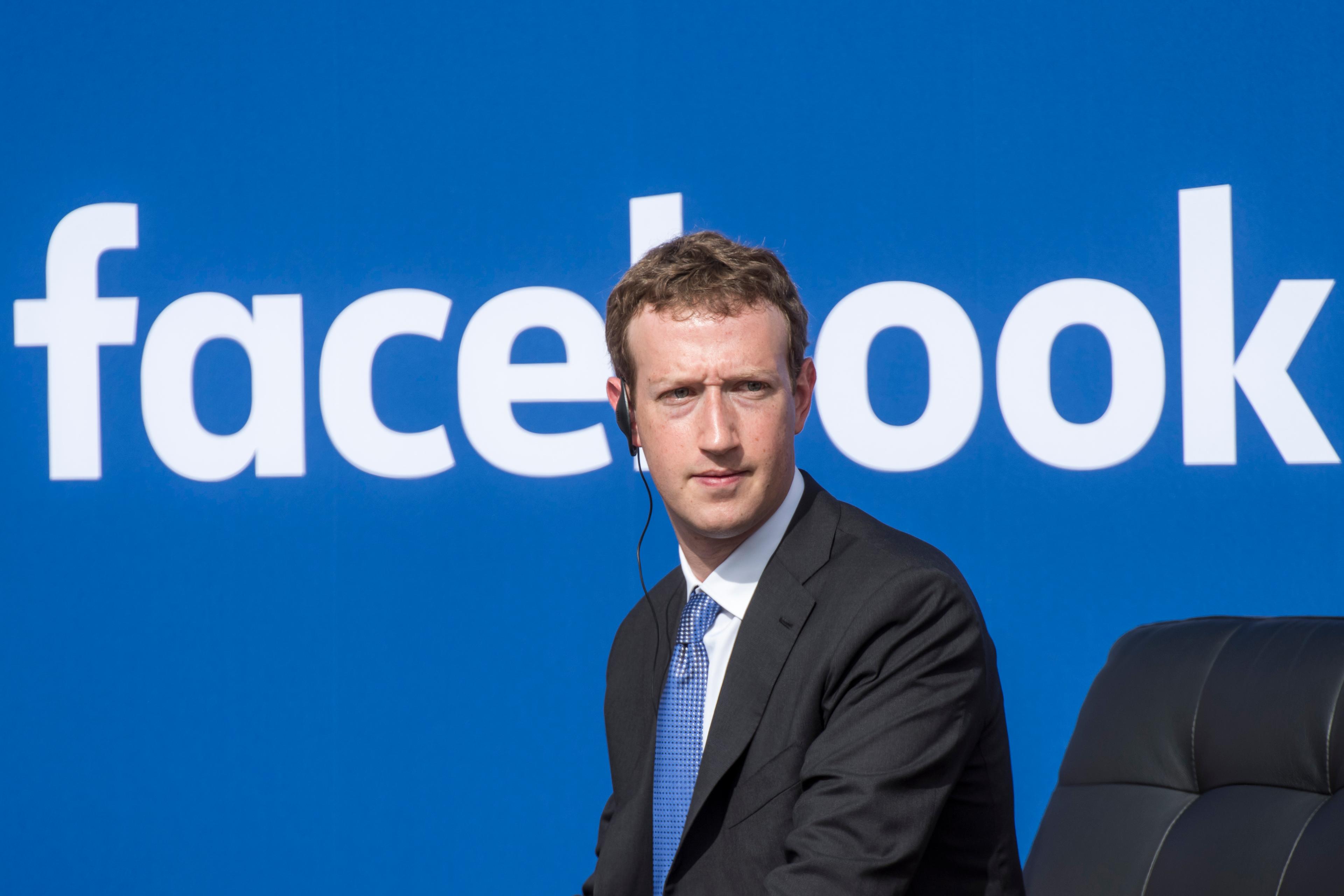 Mark Zuckerberg, chief executive officer of Facebook Inc., listens as Narendra Modi, India's prime minister, not pictured, speaks during a town hall meeting at Facebook headquarters in Menlo Park, California, U.S., on Sunday, Sept. 27, 2015.
