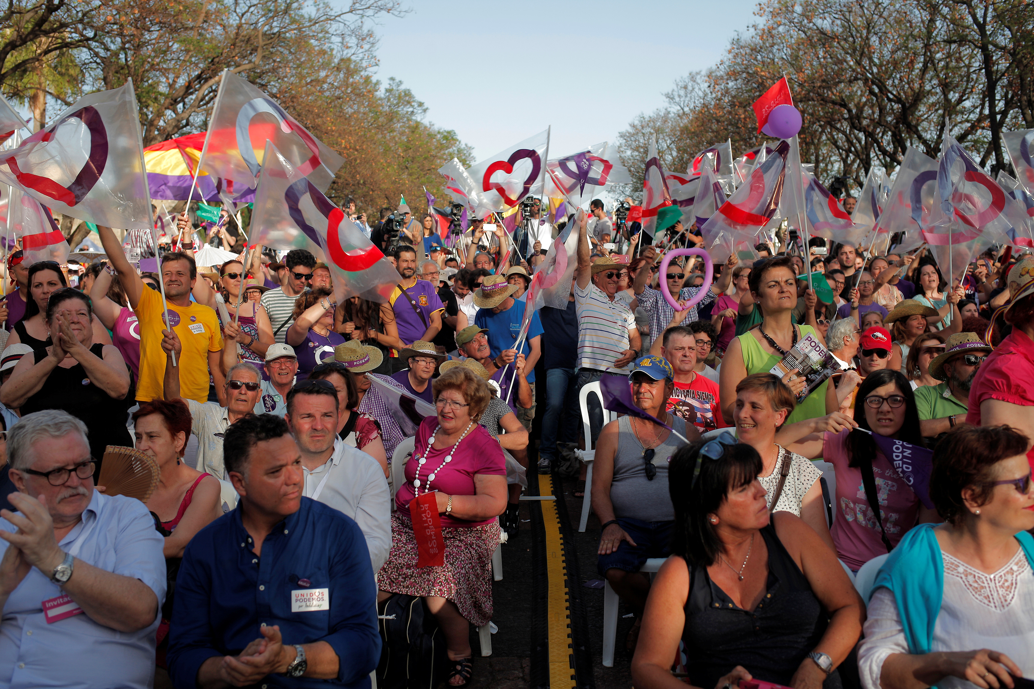 Supporters of Podemos (We Can) leader Iglesias and Izquierda Unida's (United Left) Garzon, attend to a campaign rally for Spain's upcoming general election in Jerez de la Frontera