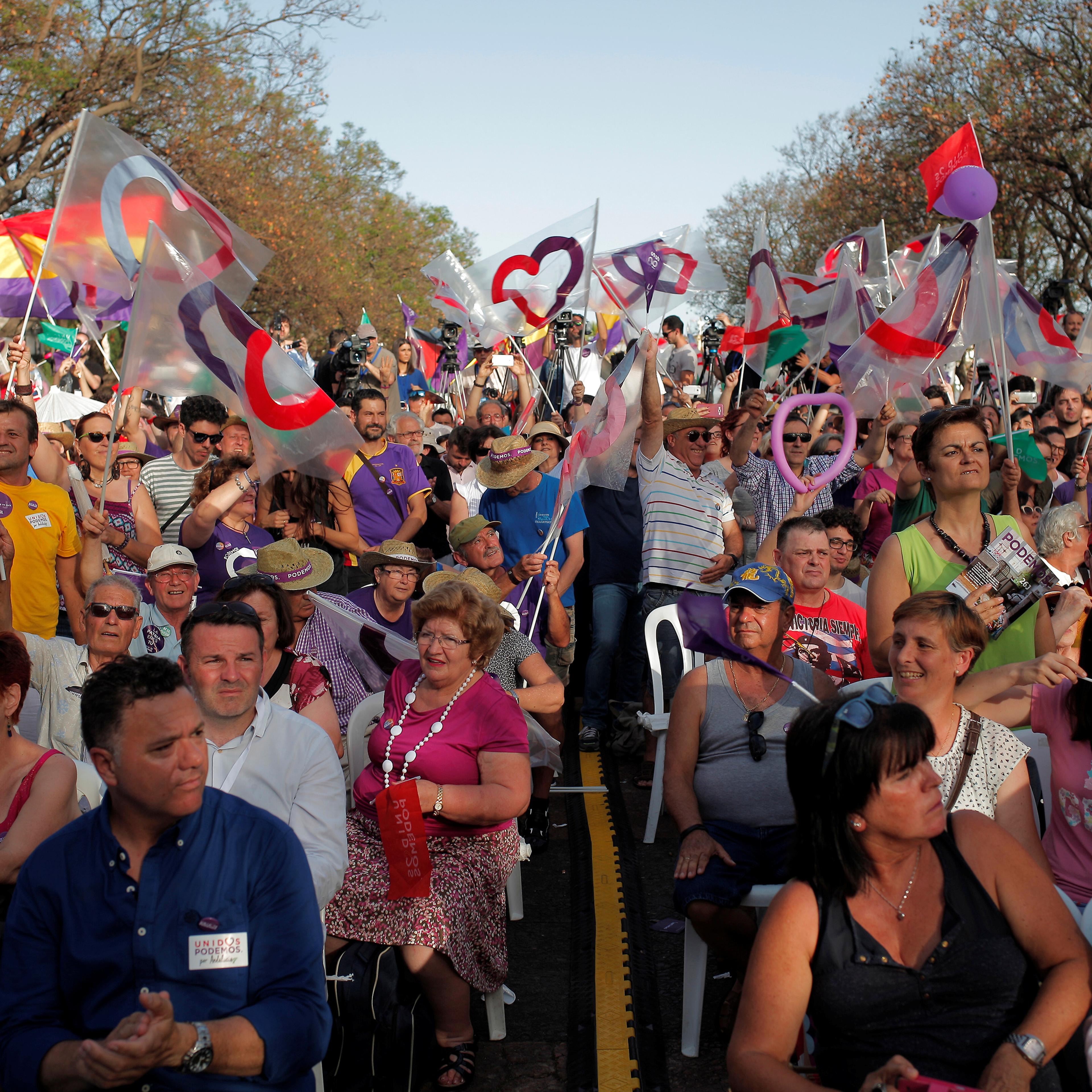 Supporters of Podemos (We Can) leader Iglesias and Izquierda Unida's (United Left) Garzon, attend to a campaign rally for Spain's upcoming general election in Jerez de la Frontera
