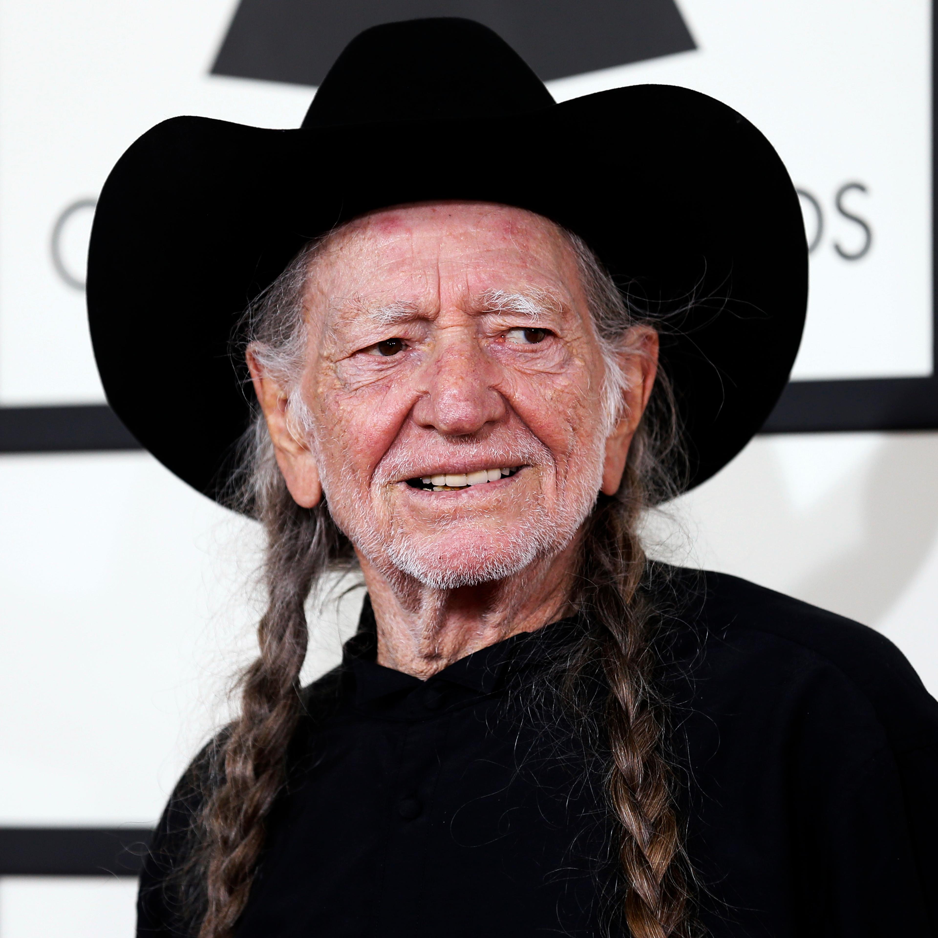 Musician Willie Nelson arrives at the 56th annual Grammy Awards in Los Angeles
