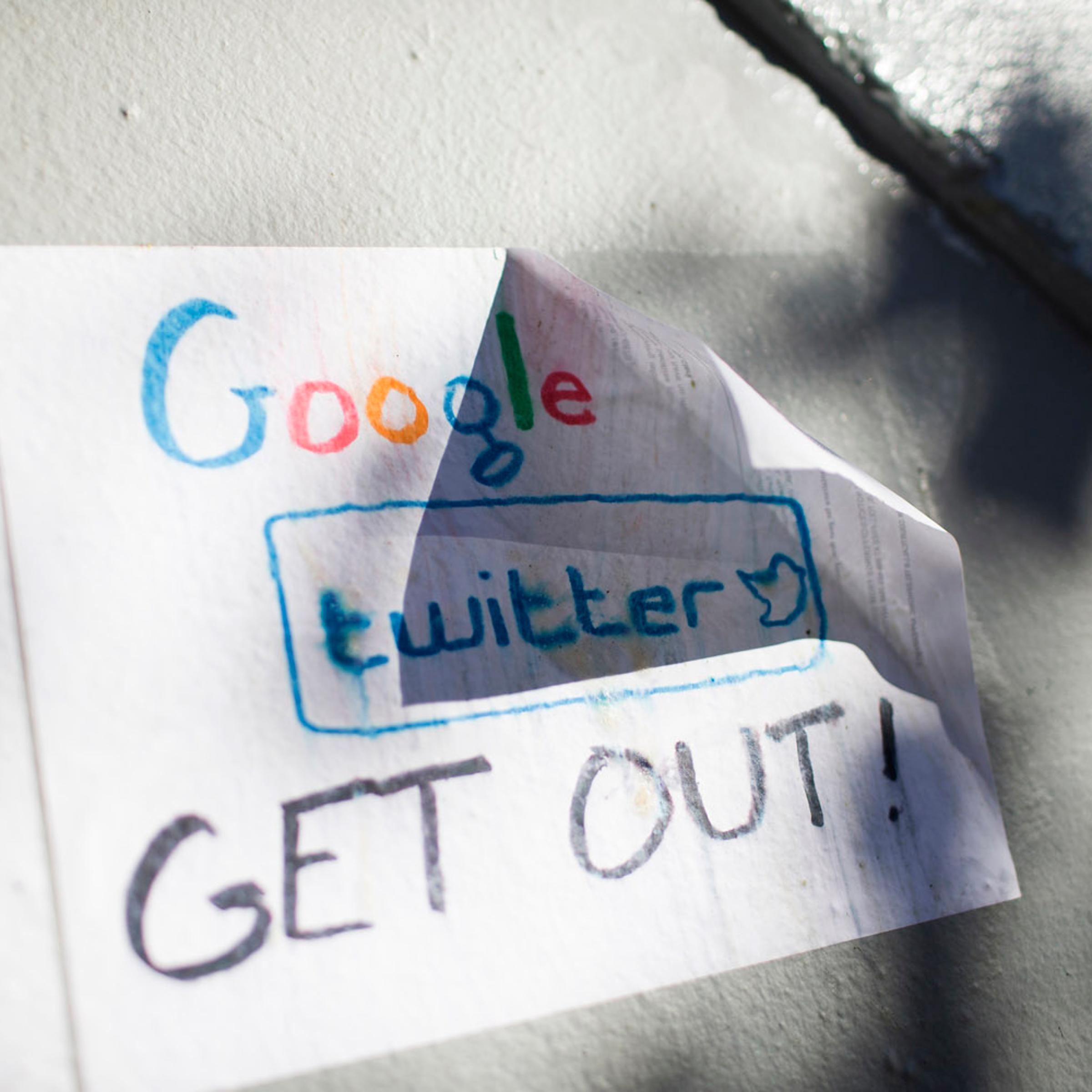Signs in opposition of technology companies are seen in San Francisco, California Dec. 9, 2013.