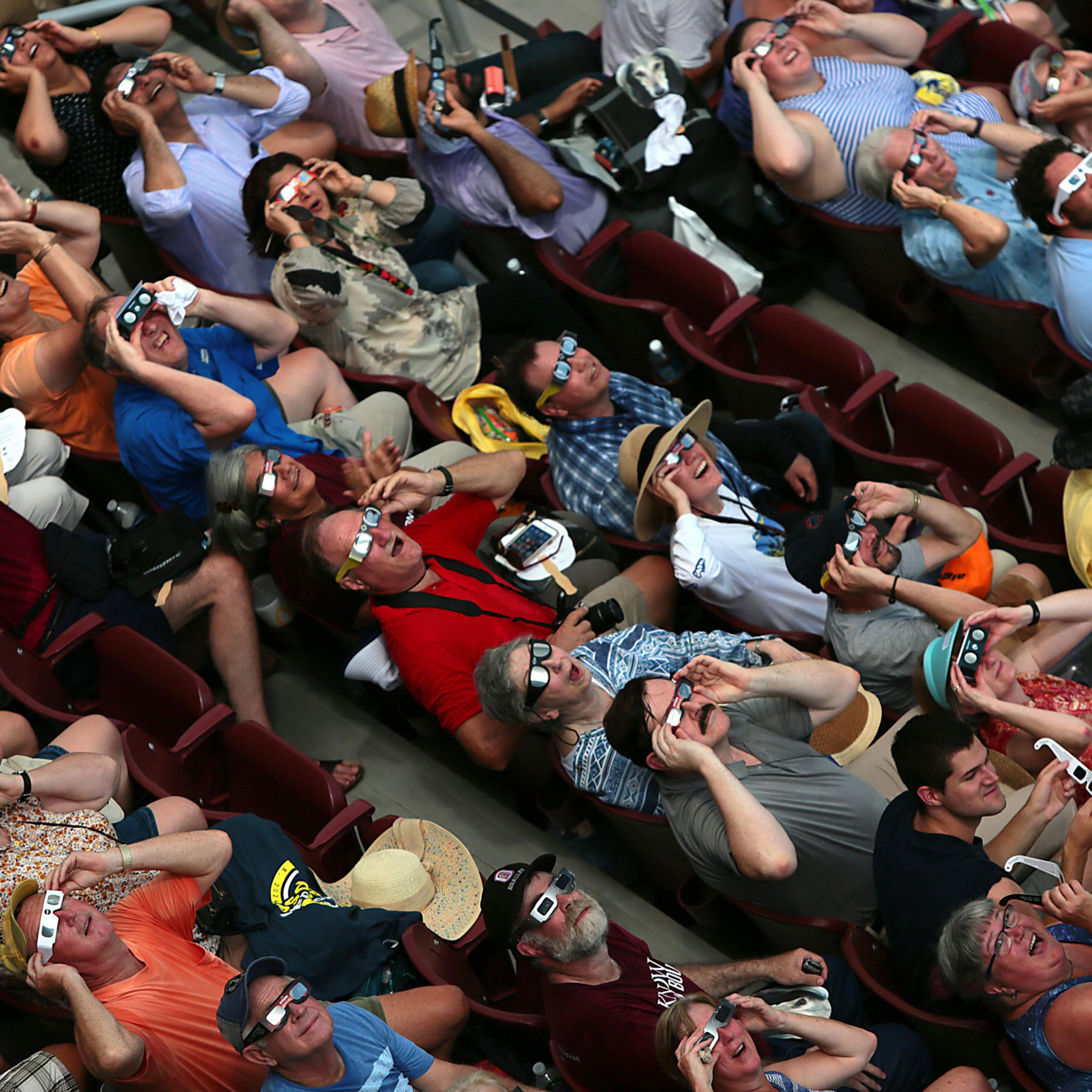 Clouds break in time to the cheers of fans who got to briefly see the total eclipse inside Saluki Stadium on the campus of Southern Illinois University Carbondale on Aug. 21, 2017.