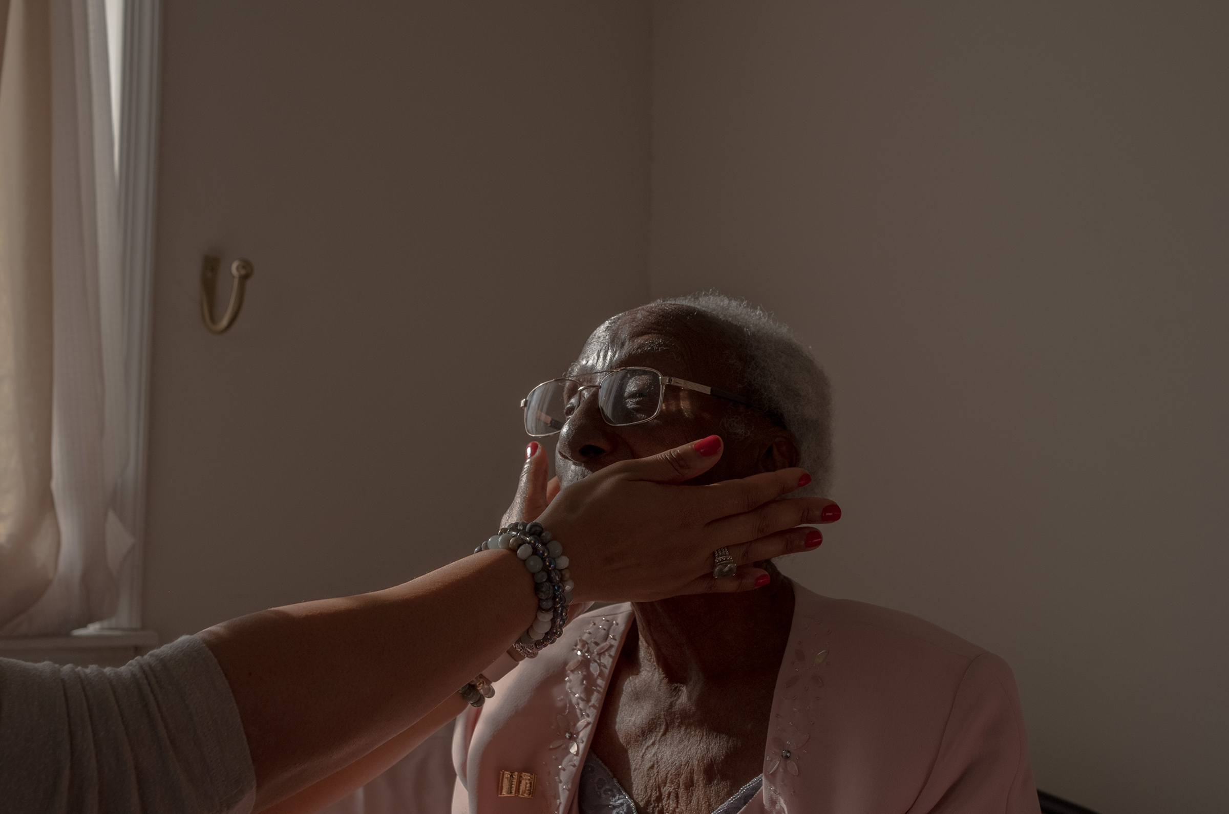 End-of-life doula Michelle Thornhill meets with her client, Estella Stackhouse, 101, at Stackhouse’s home in Philadelphia, on Jan. 19, 2022.