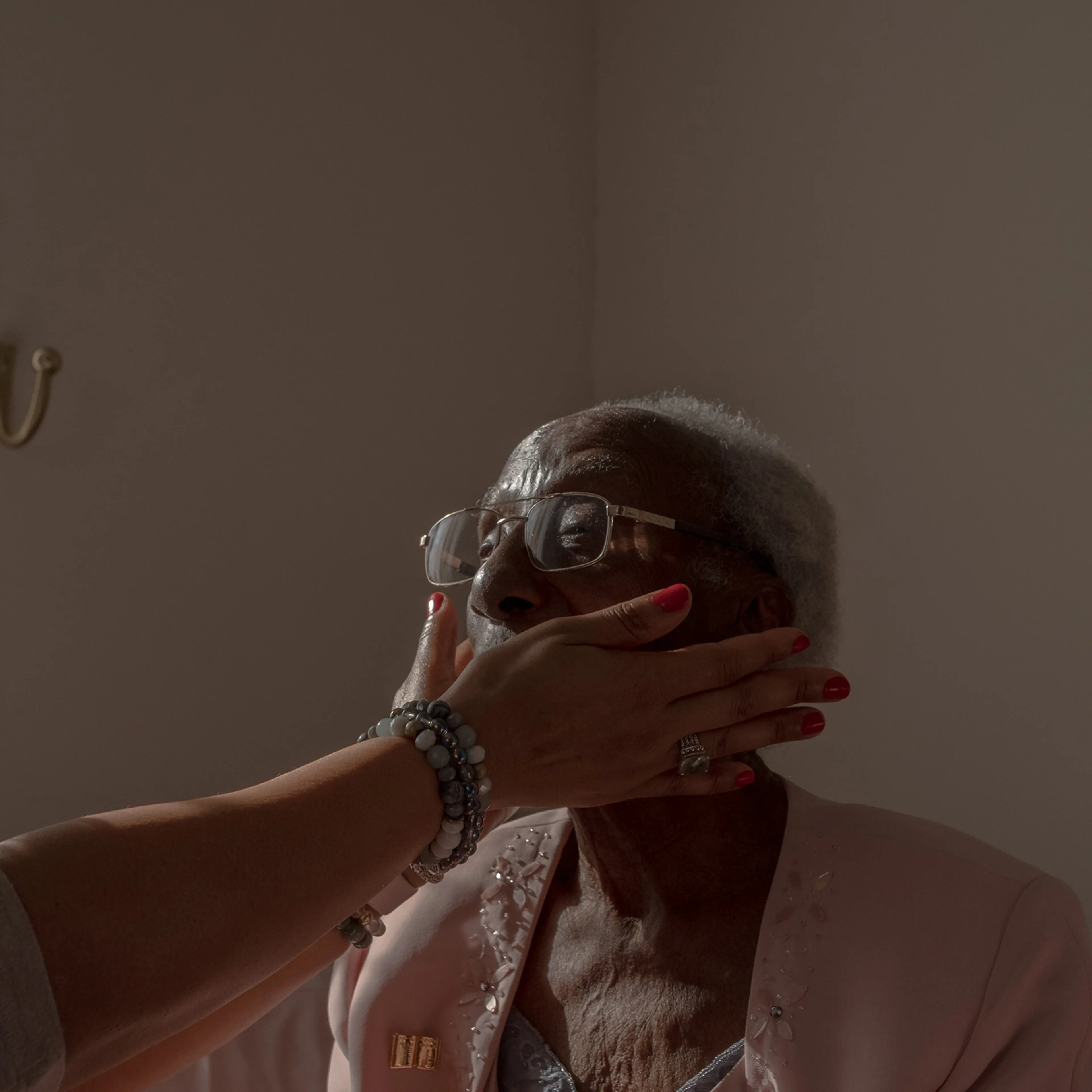End-of-life doula Michelle Thornhill meets with her client, Estella Stackhouse, 101, at Stackhouse’s home in Philadelphia, on Jan. 19, 2022.