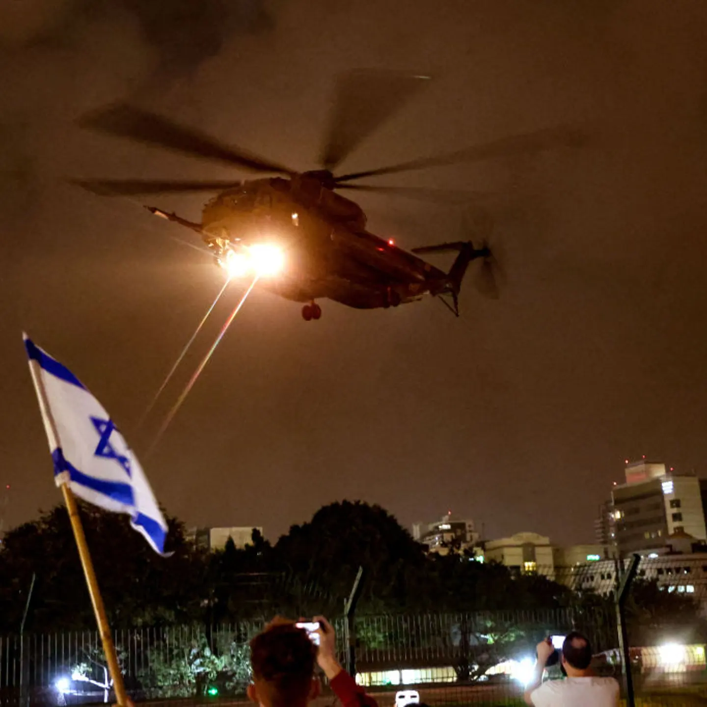 A helicopter transports hostages released by Hamas