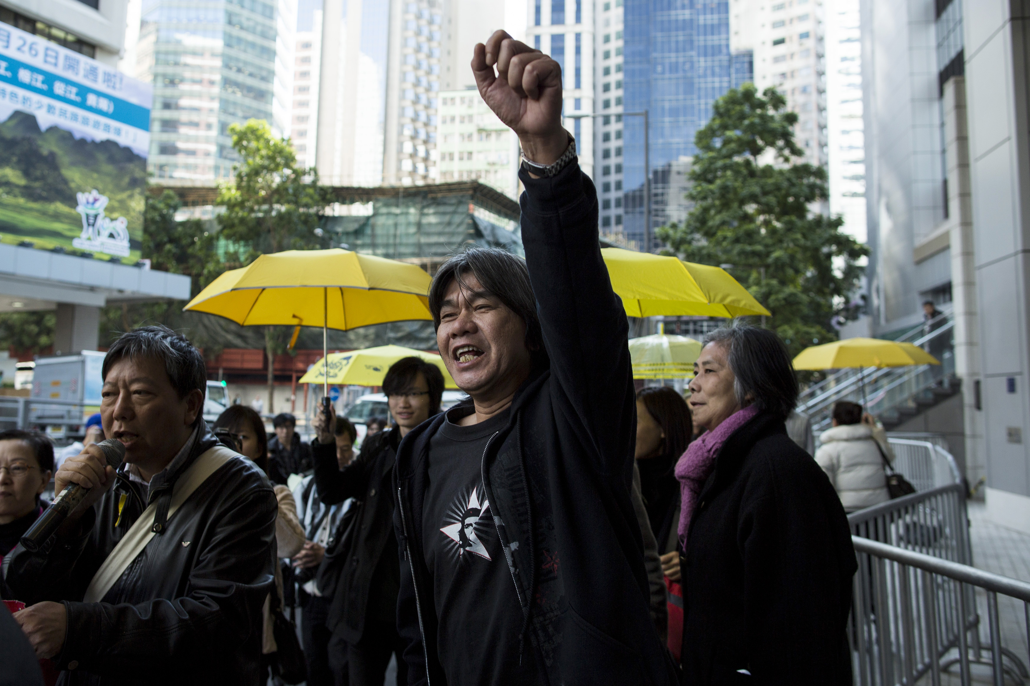 League of Social Democrats lawmaker "Long Hair" Leung Kwok-hung arrives at police headquarters to assist investigations in relation to the Occupy movement in Hong Kong