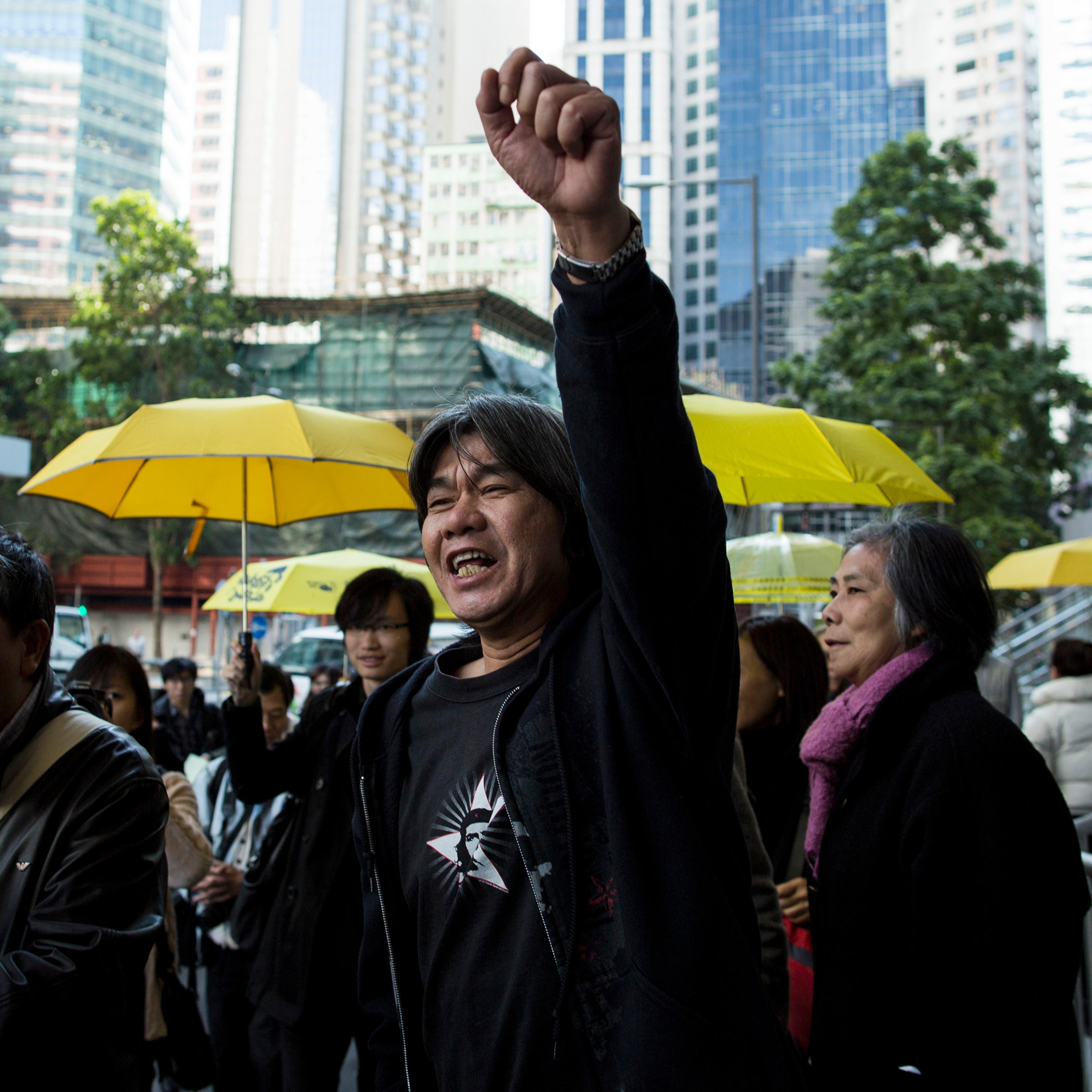 League of Social Democrats lawmaker "Long Hair" Leung Kwok-hung arrives at police headquarters to assist investigations in relation to the Occupy movement in Hong Kong
