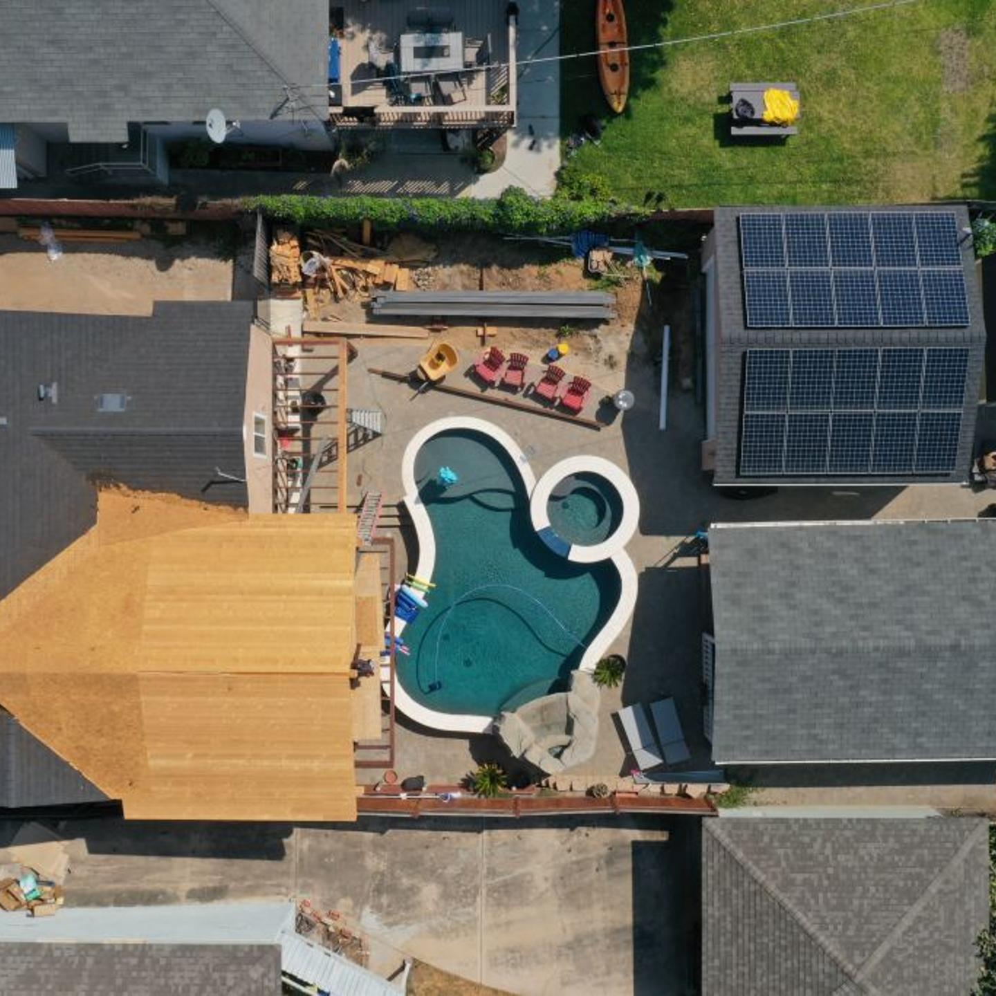 A home with a backyard pool and rooftop solar panels under construction in this aerial photograph taken over the Pacific Beach neighborhood of San Diego.