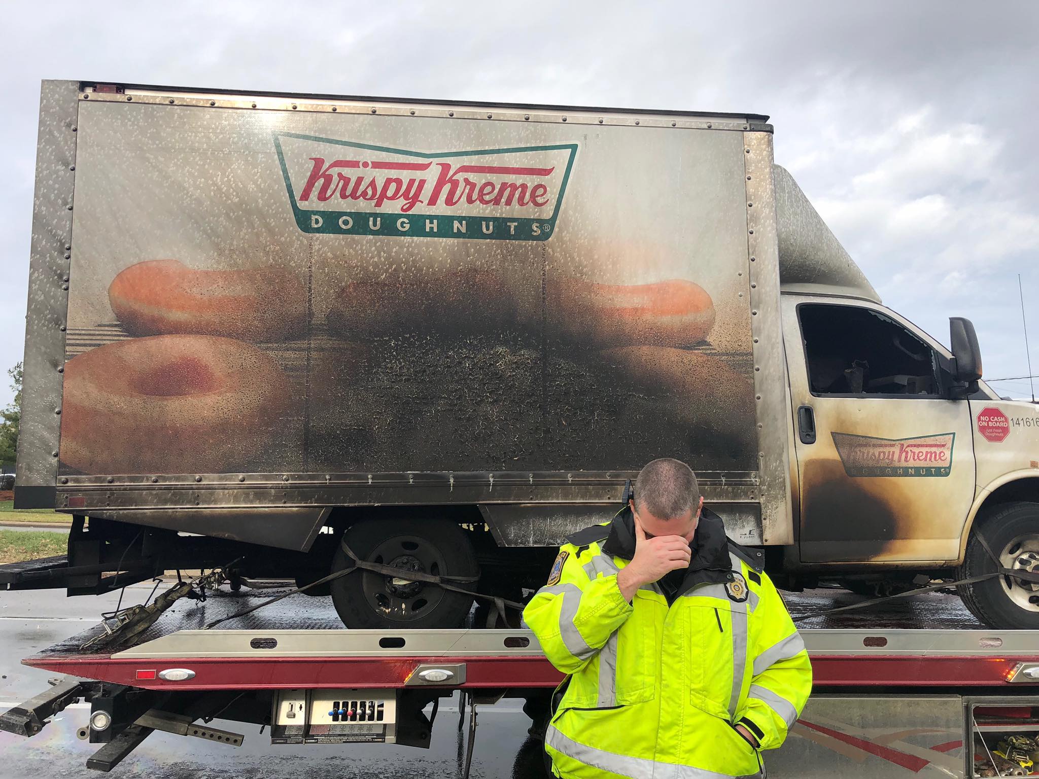 A police officer reacts to a Krispy Kreme truck that caught on fire in Lexington, Ky., on Dec. 31. Nobody was hurt, but local officers had fun on twitter after the incident. 