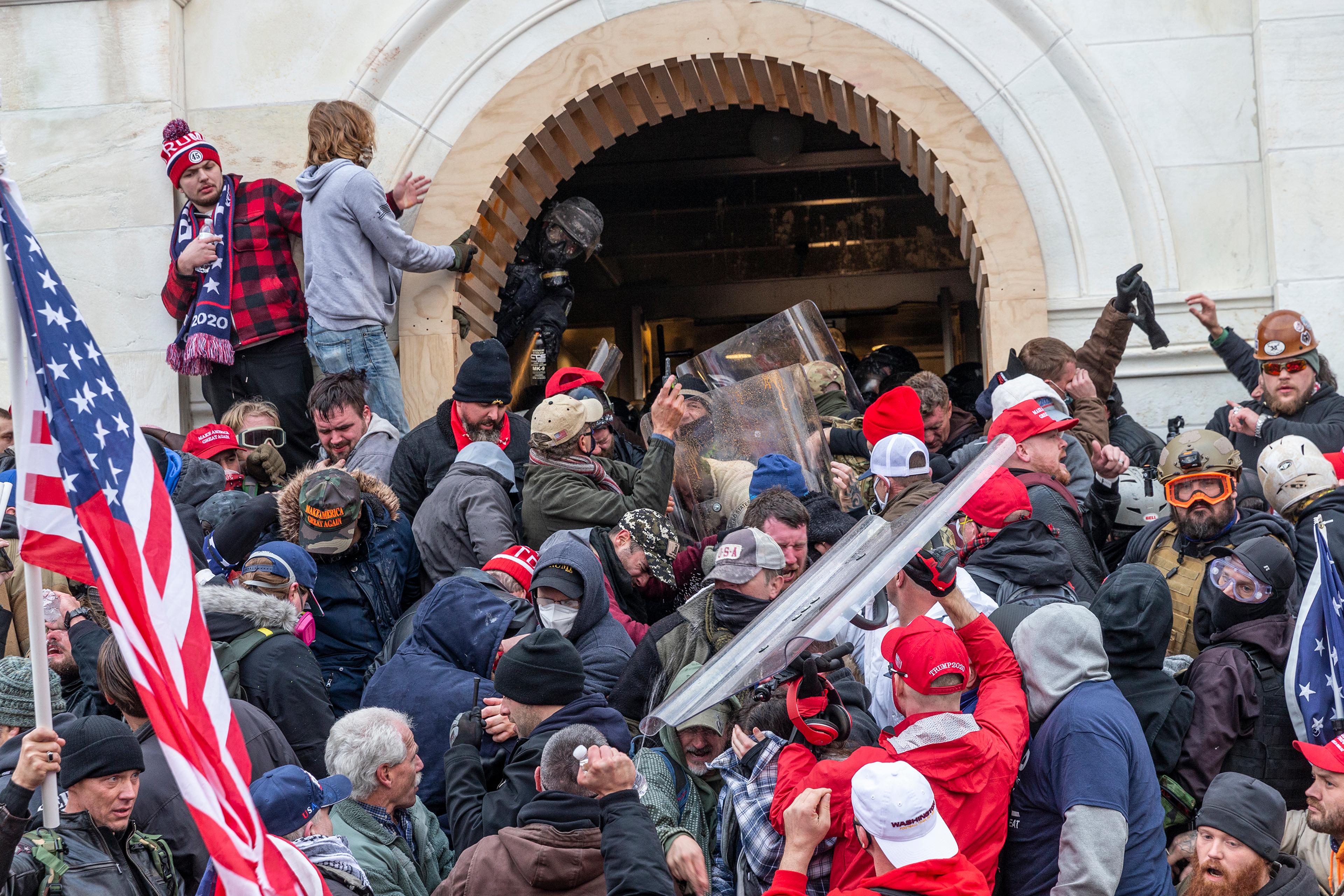 Rioters clash with police trying to enter Capitol building
