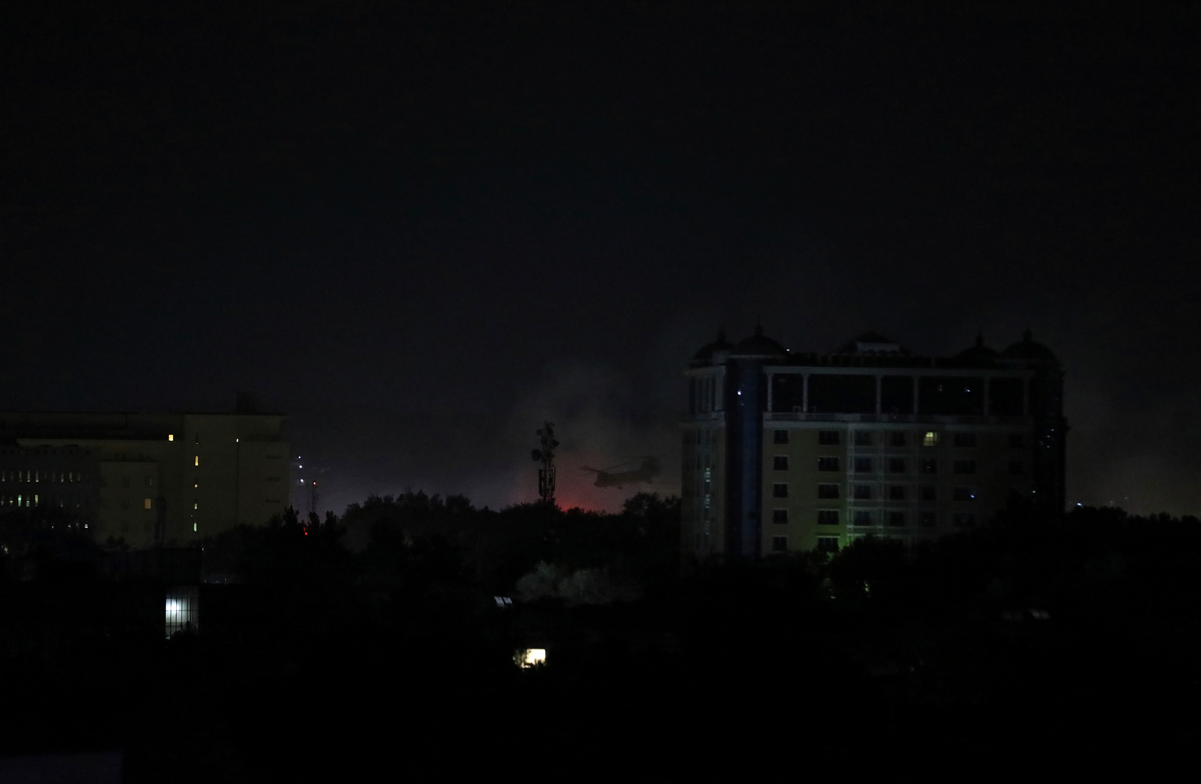 Smoke rises next to the U.S. Embassy in Kabul late on Aug. 15, 2021.
