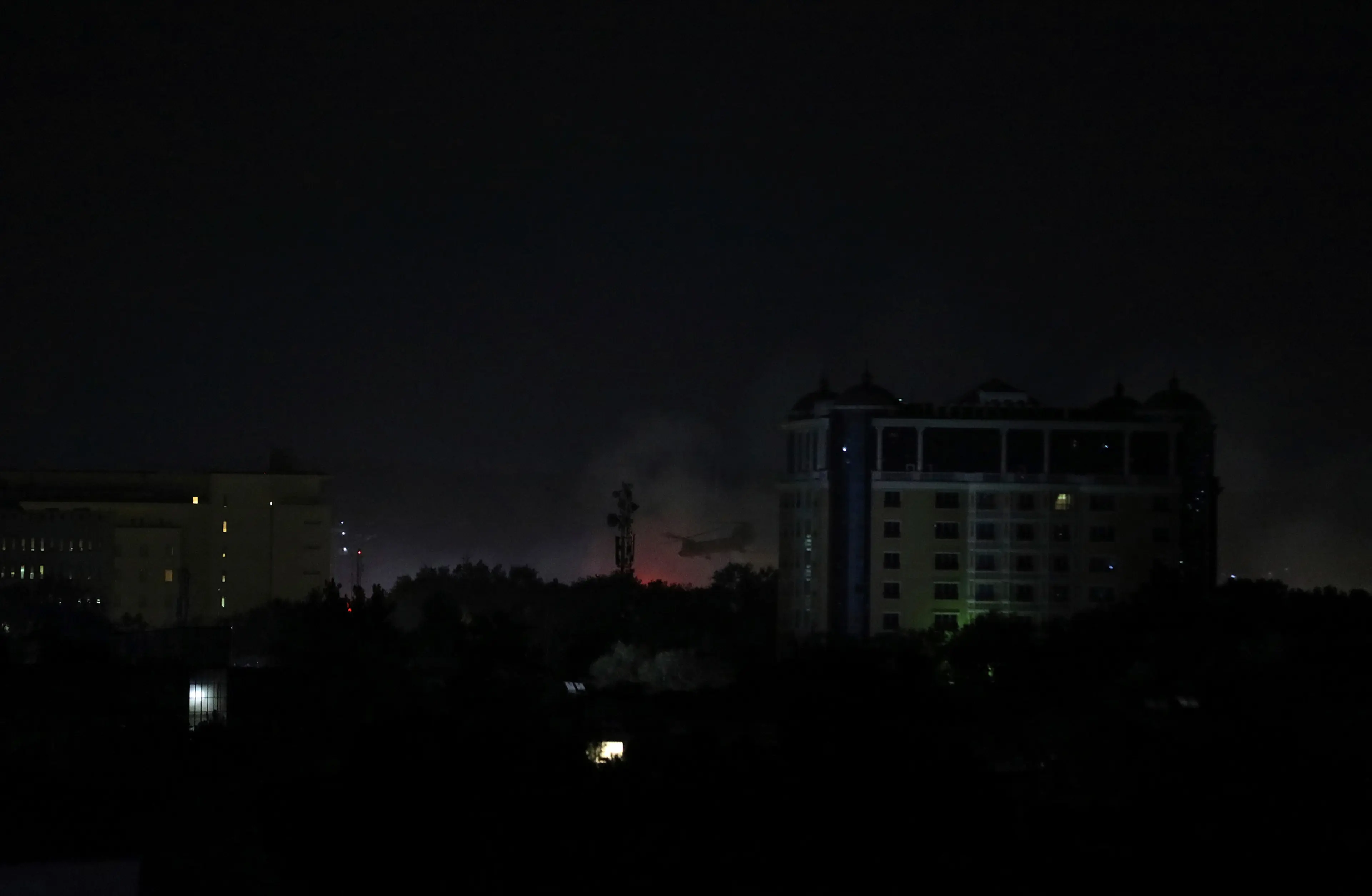 Smoke rises next to the U.S. Embassy in Kabul late on Aug. 15, 2021.