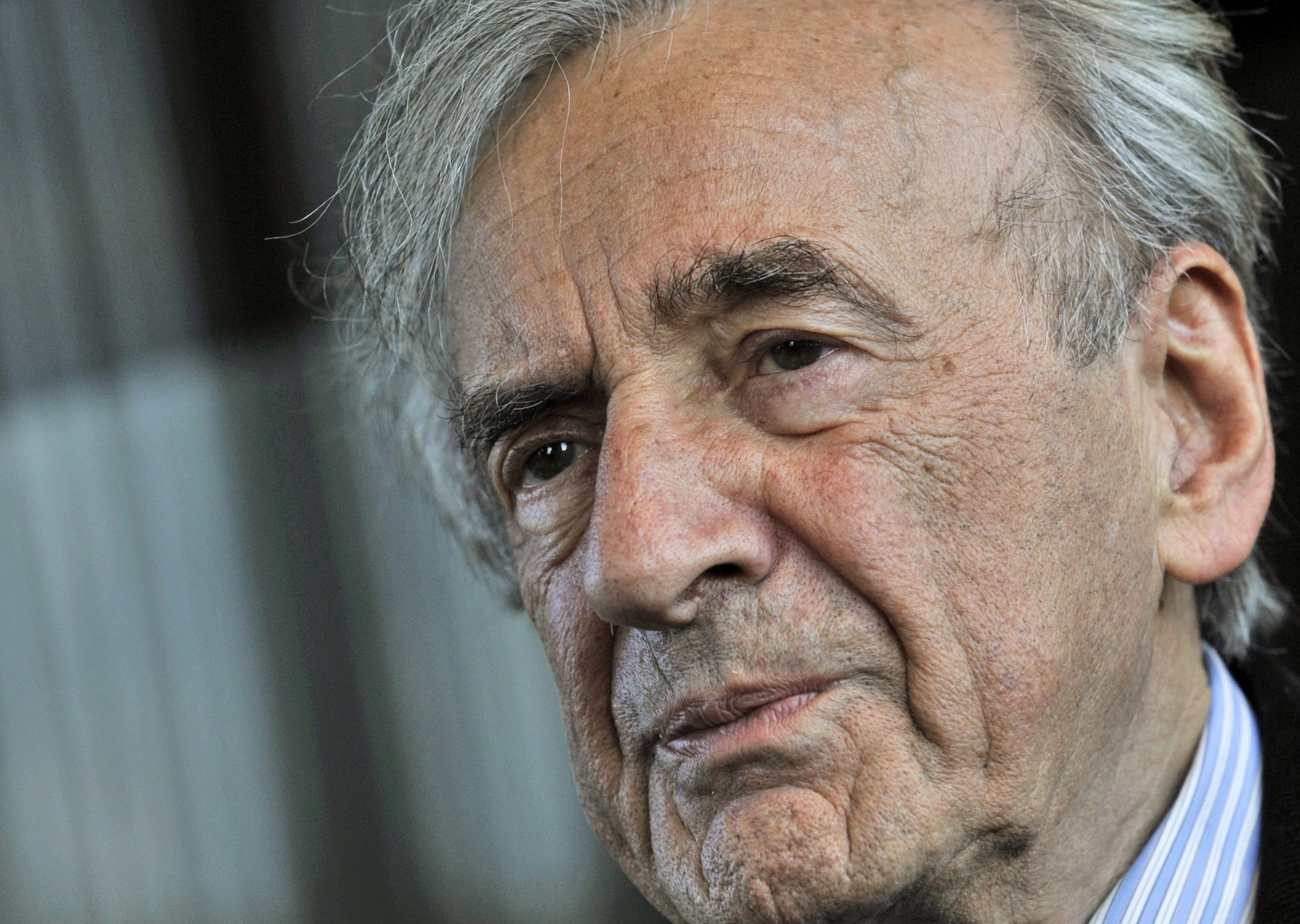 Holocaust survivor and Nobel Peace Prize winning author Elie Wiesel listens during an interview with The Associated Press in Budapest, Hungary, Dec. 10, 2009.