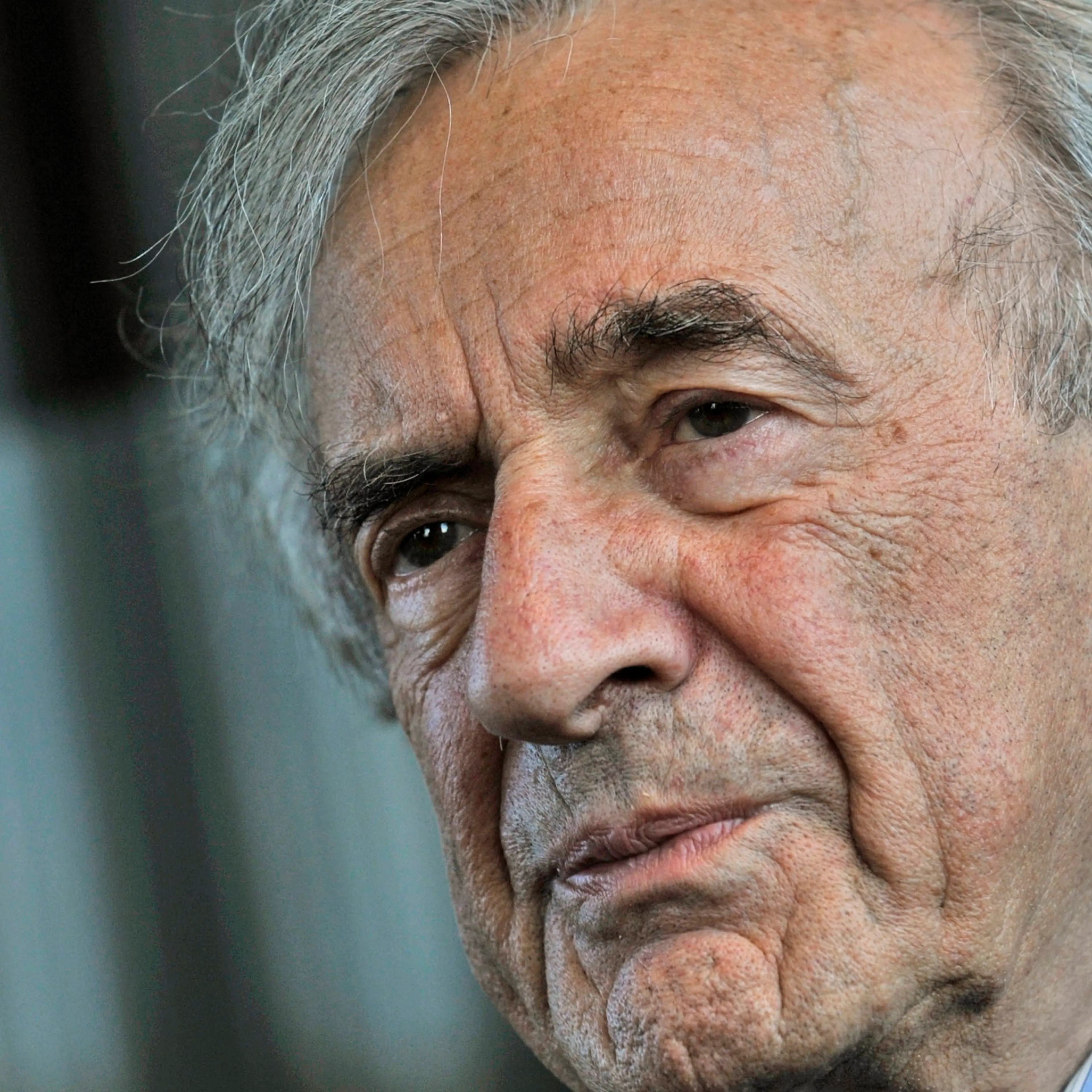Holocaust survivor and Nobel Peace Prize winning author Elie Wiesel listens during an interview with The Associated Press in Budapest, Hungary, Dec. 10, 2009.