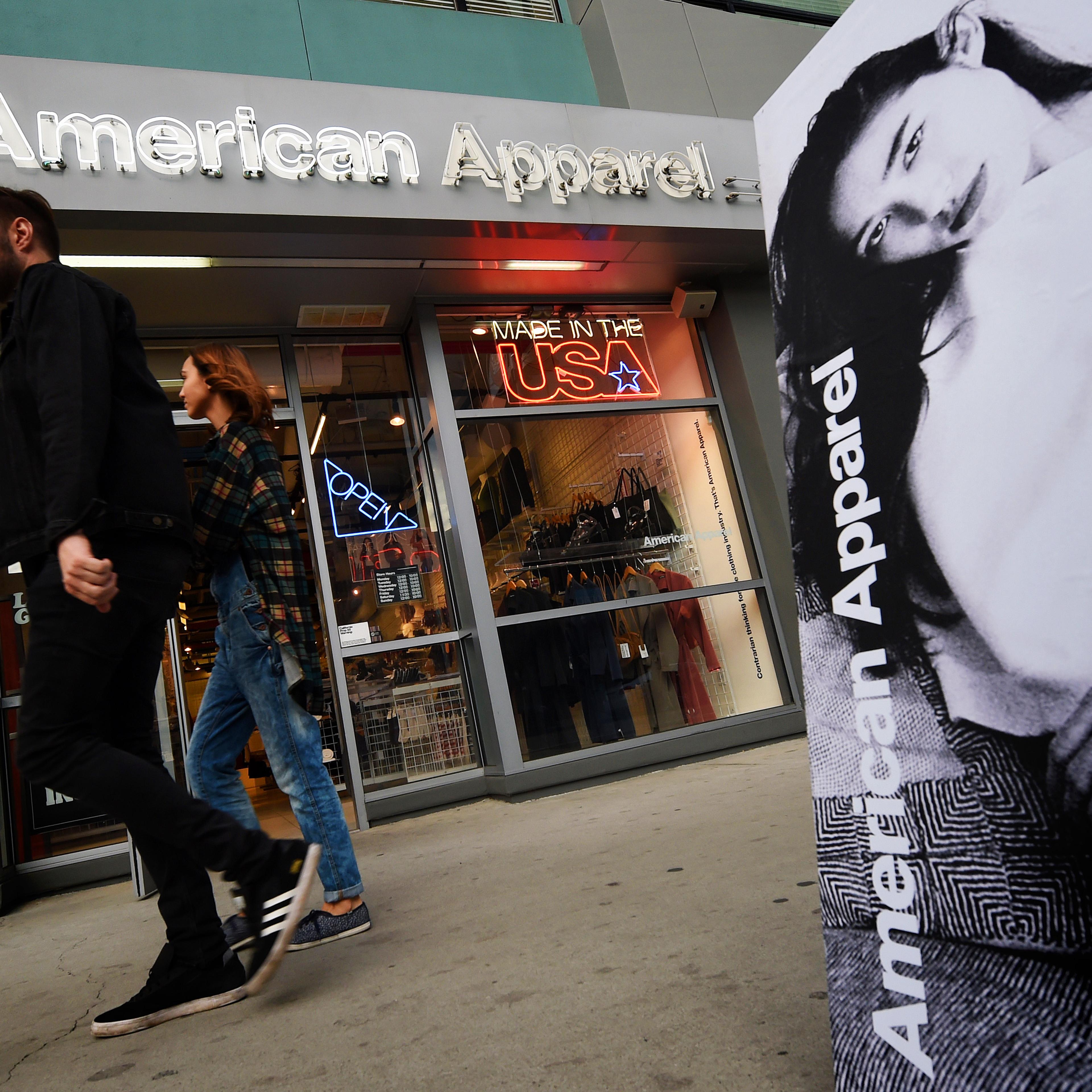 People walk past an American Apparel store in downtown Los Angeles on Jan. 27, 2016.