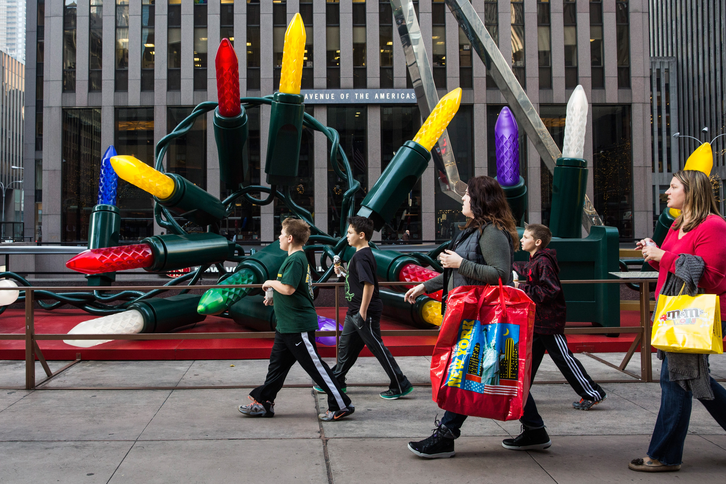 Children walk down Sixth Avenue wearing t-shirts thanks to 60 degree weather on Dec. 10, 2015 in New York City.