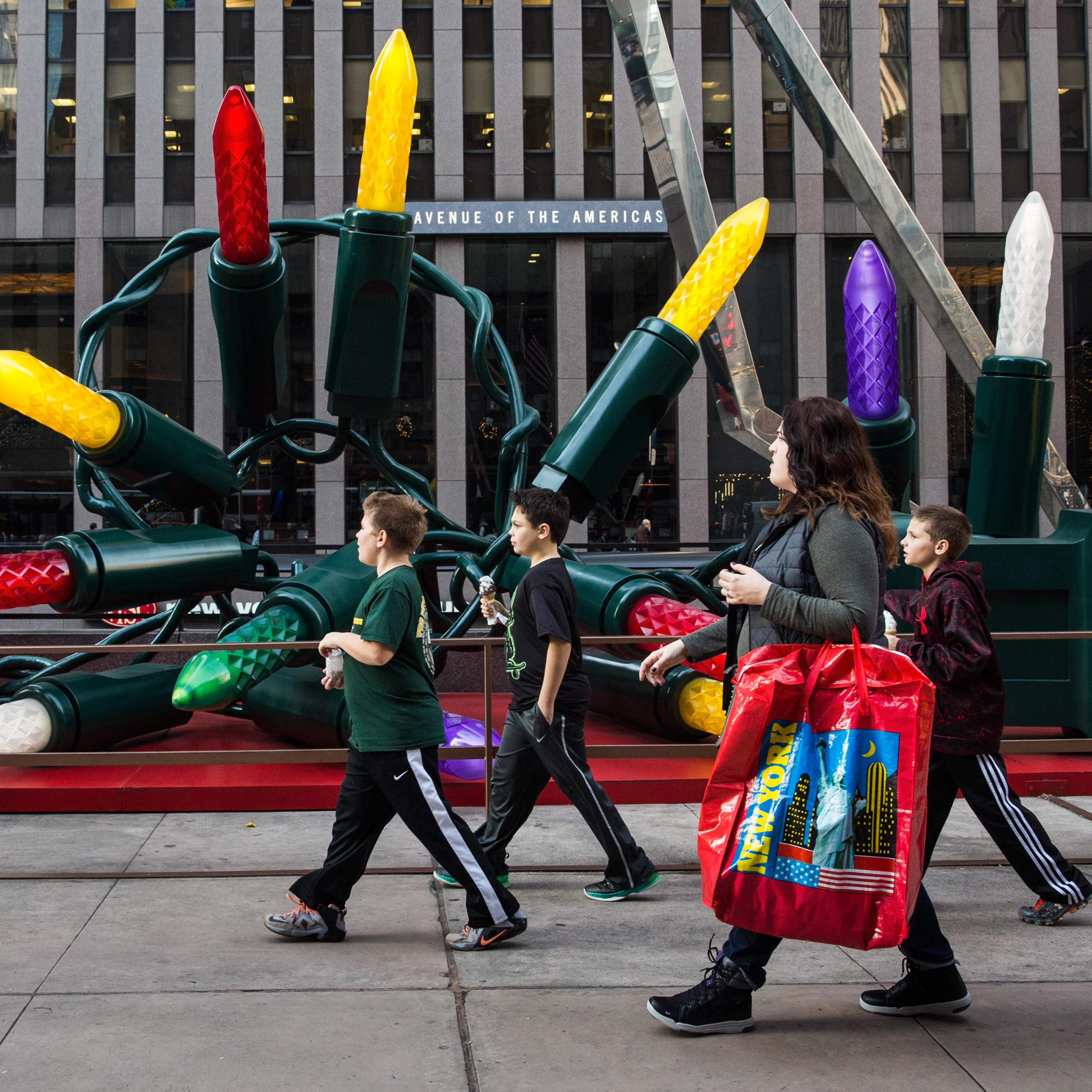 Children walk down Sixth Avenue wearing t-shirts thanks to 60 degree weather on Dec. 10, 2015 in New York City.