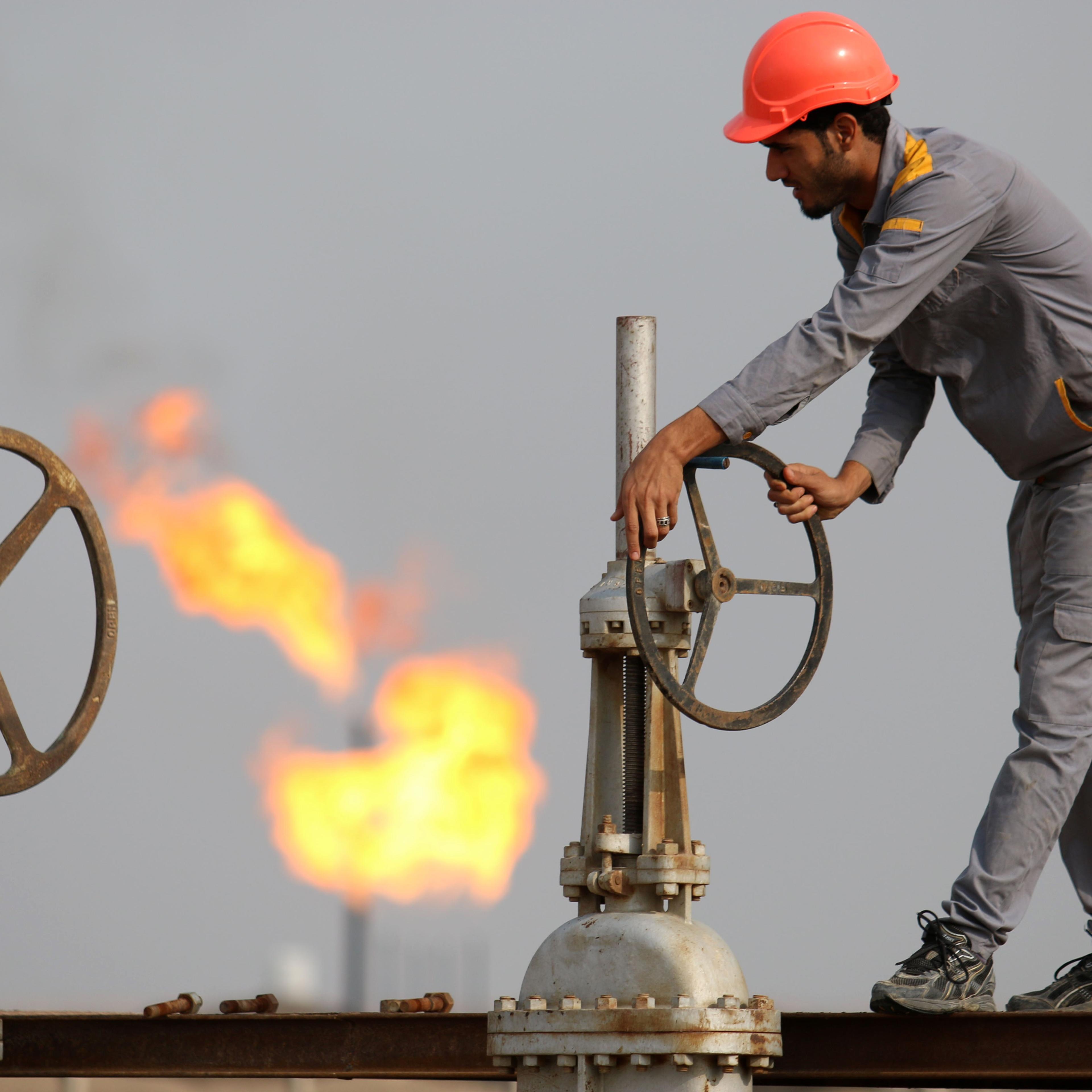 An Iraqi labourer works at an oil refinery in the southern town Nasiriyah on October 30, 2015.