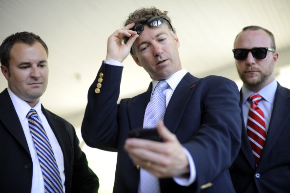 In this file photo, Dr. Rand Paul looks at a campaign ad on his phone while running for the U.S. Senate.