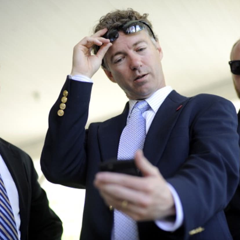 In this file photo, Dr. Rand Paul looks at a campaign ad on his phone while running for the U.S. Senate.