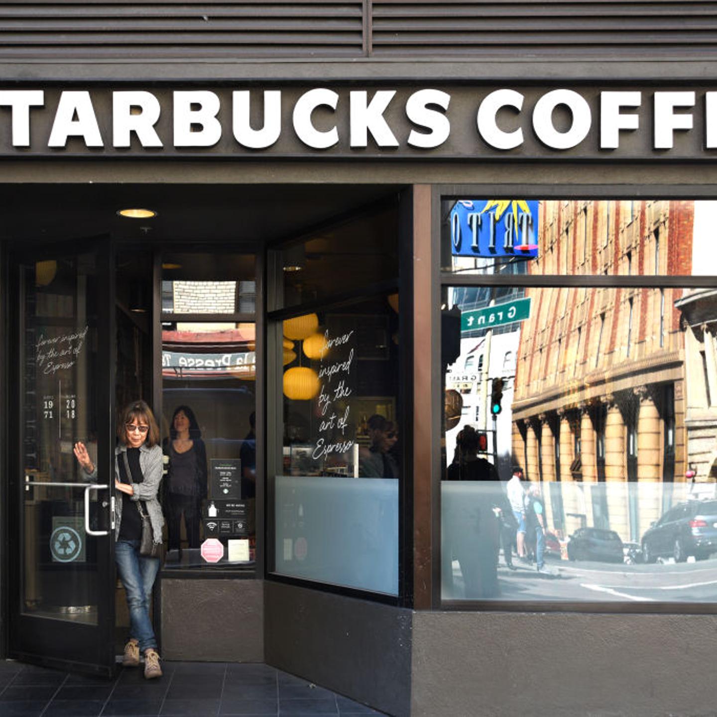 A customer leaves a Starbucks Coffee shop