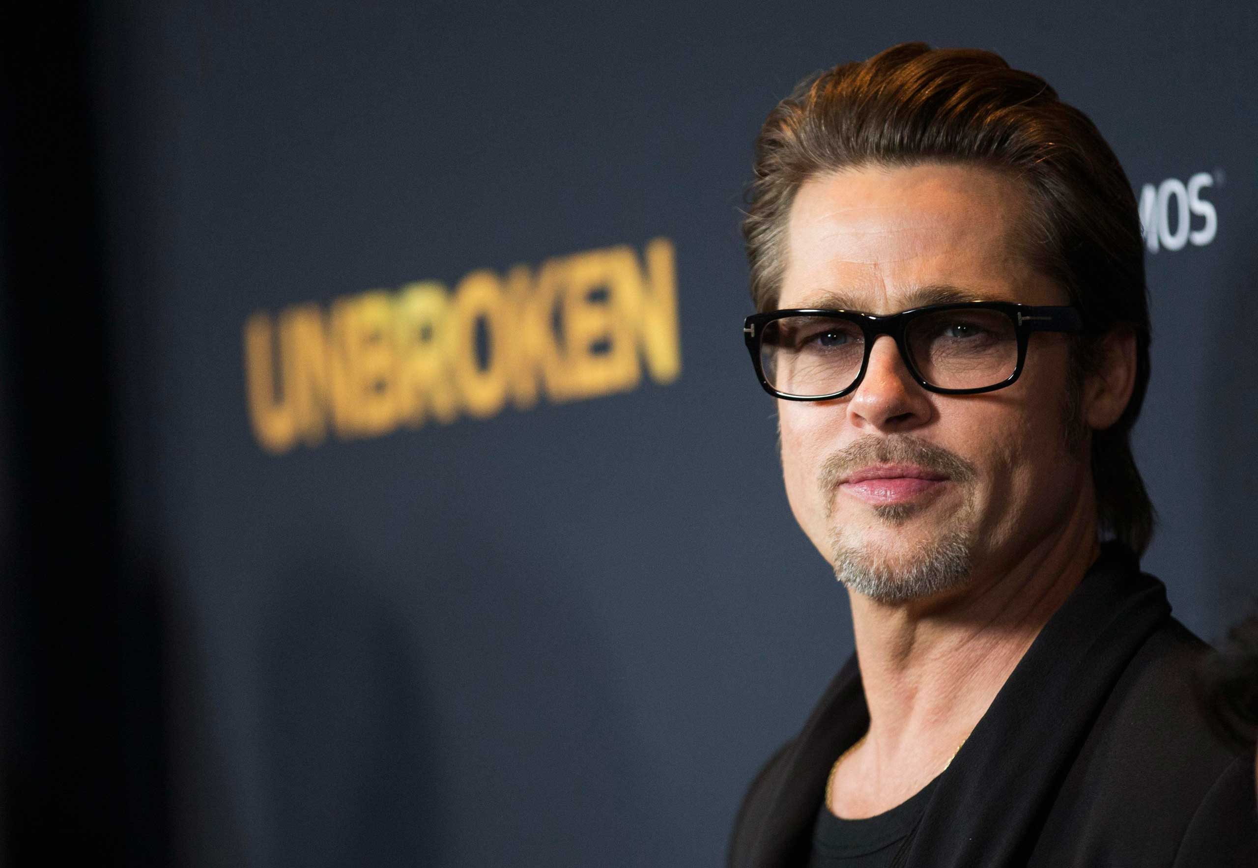 Actor Pitt poses at the premiere of "Unbroken" at Dolby theatre in Hollywood