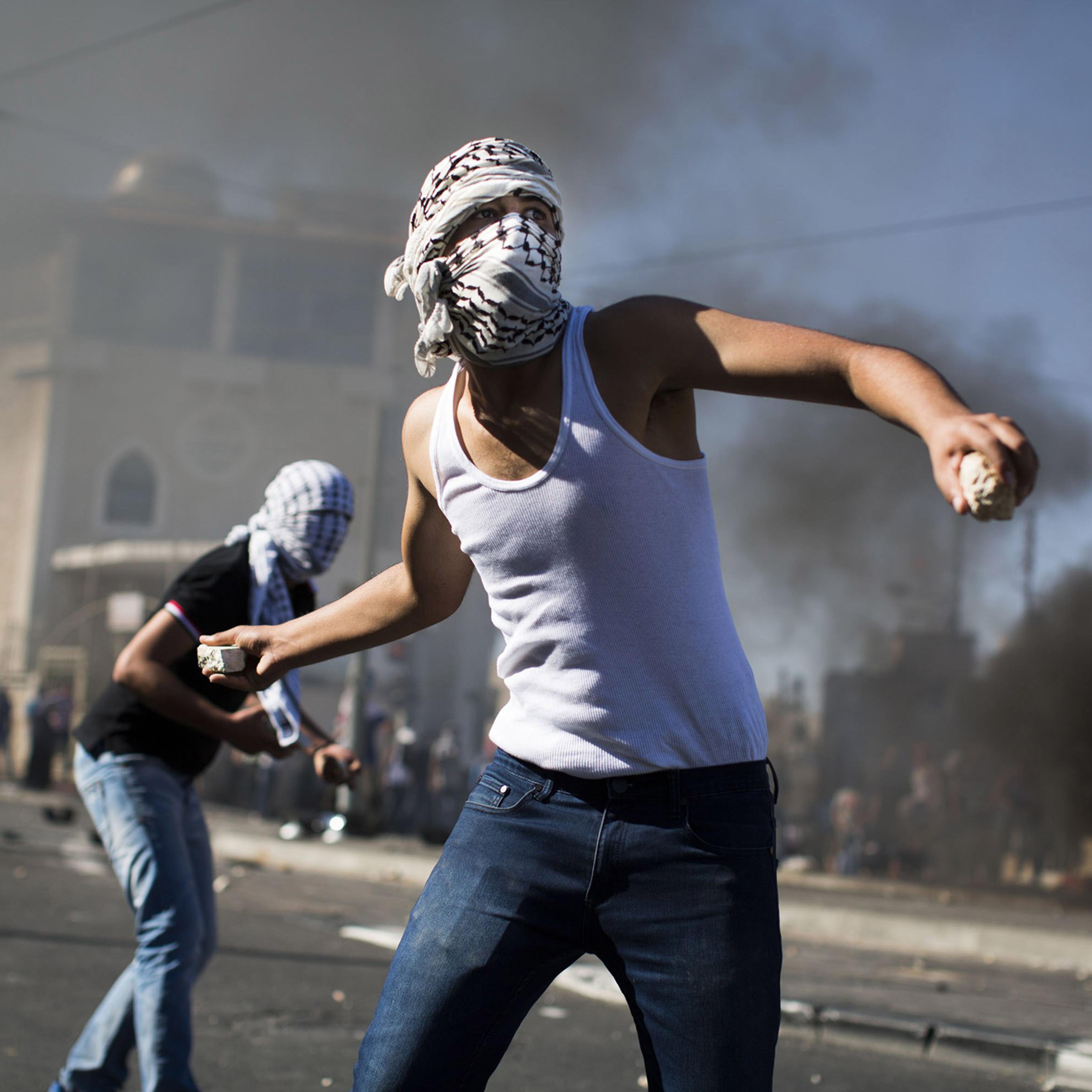 Palestinian youths clash with Israeli Police near to the house of murdered Palestinian teenager Mohammed Abu Khdair, in Jerusalem on July 2.