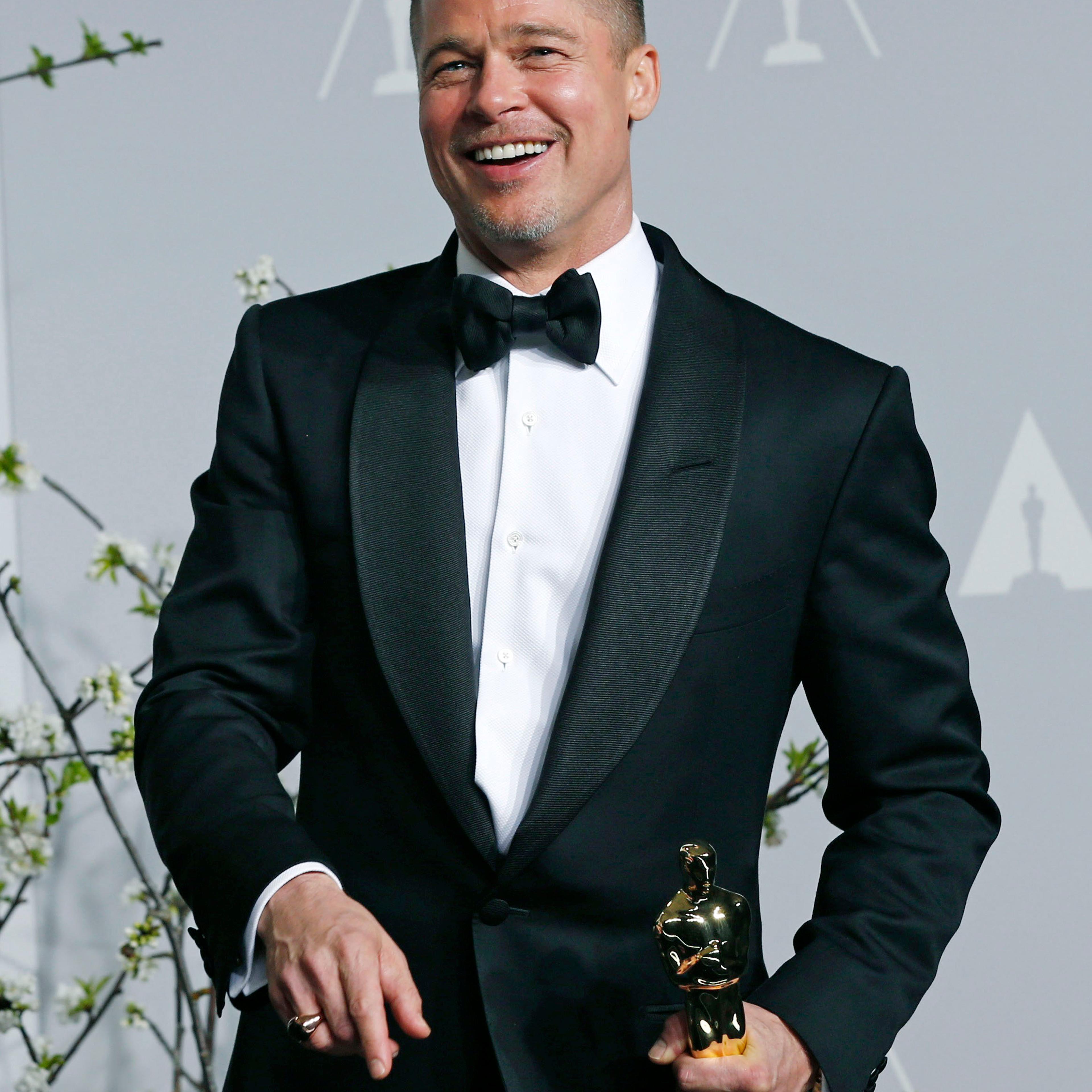 Brad Pitt at the 86th Academy Awards in Hollywood on March 2, 2014 after winning best picture for "12 Years a Slave".
