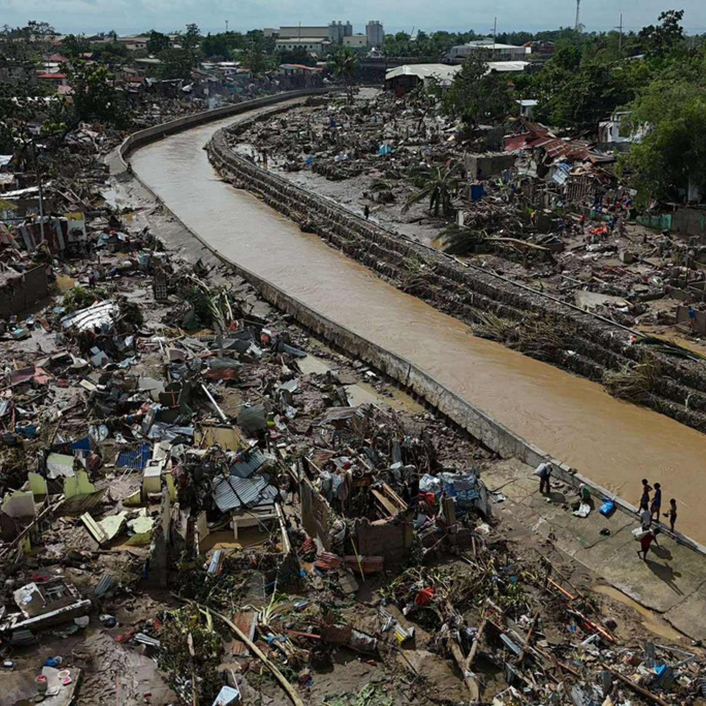 Residents return to what remains of their homes after Typhoon Kalmaegi devastated communities along the Mananga River in Talisay City, Cebu province, central Philippines, on Nov. 5, 2025.