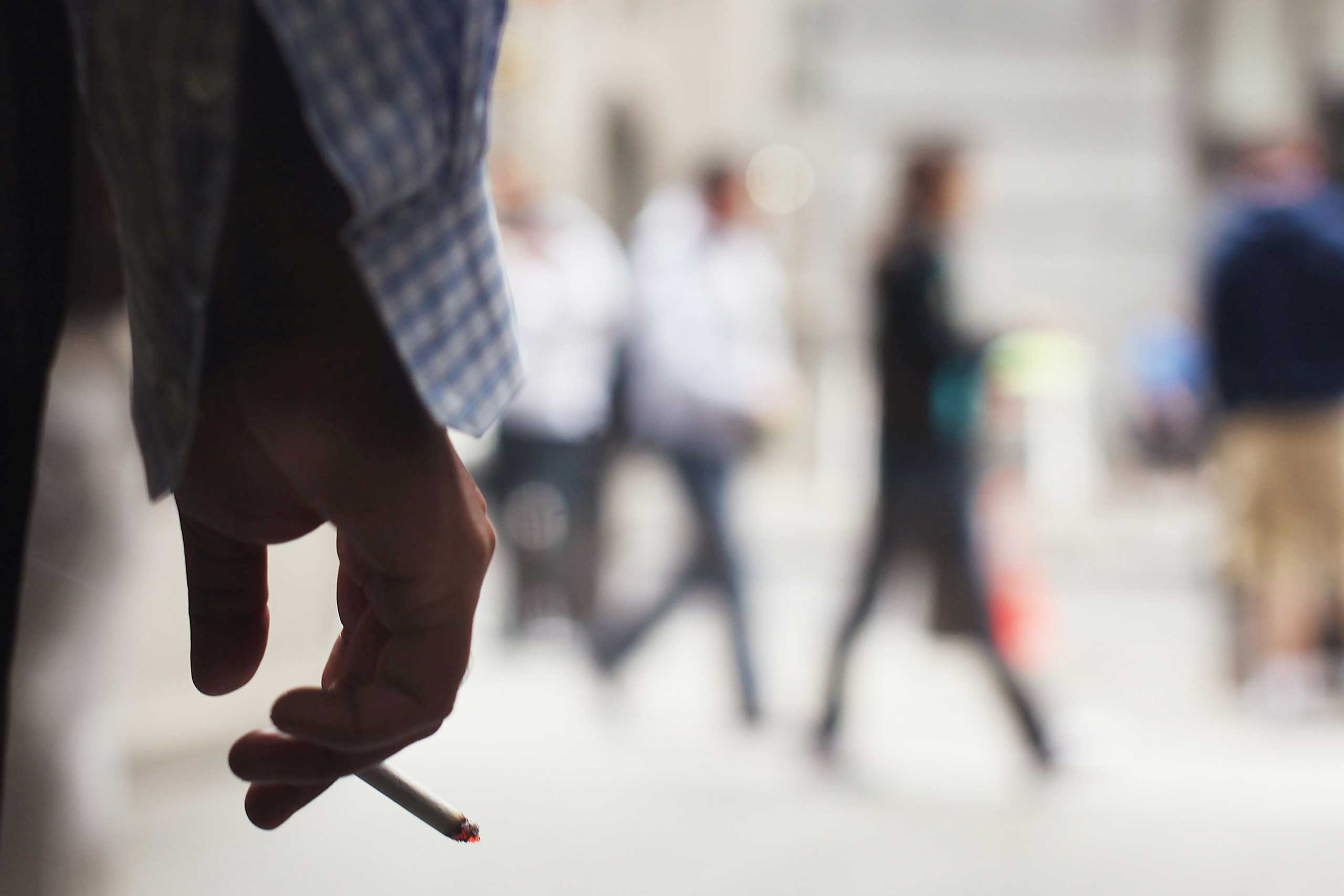 A man smokes outside of a building on June 11, 2009 in New York.