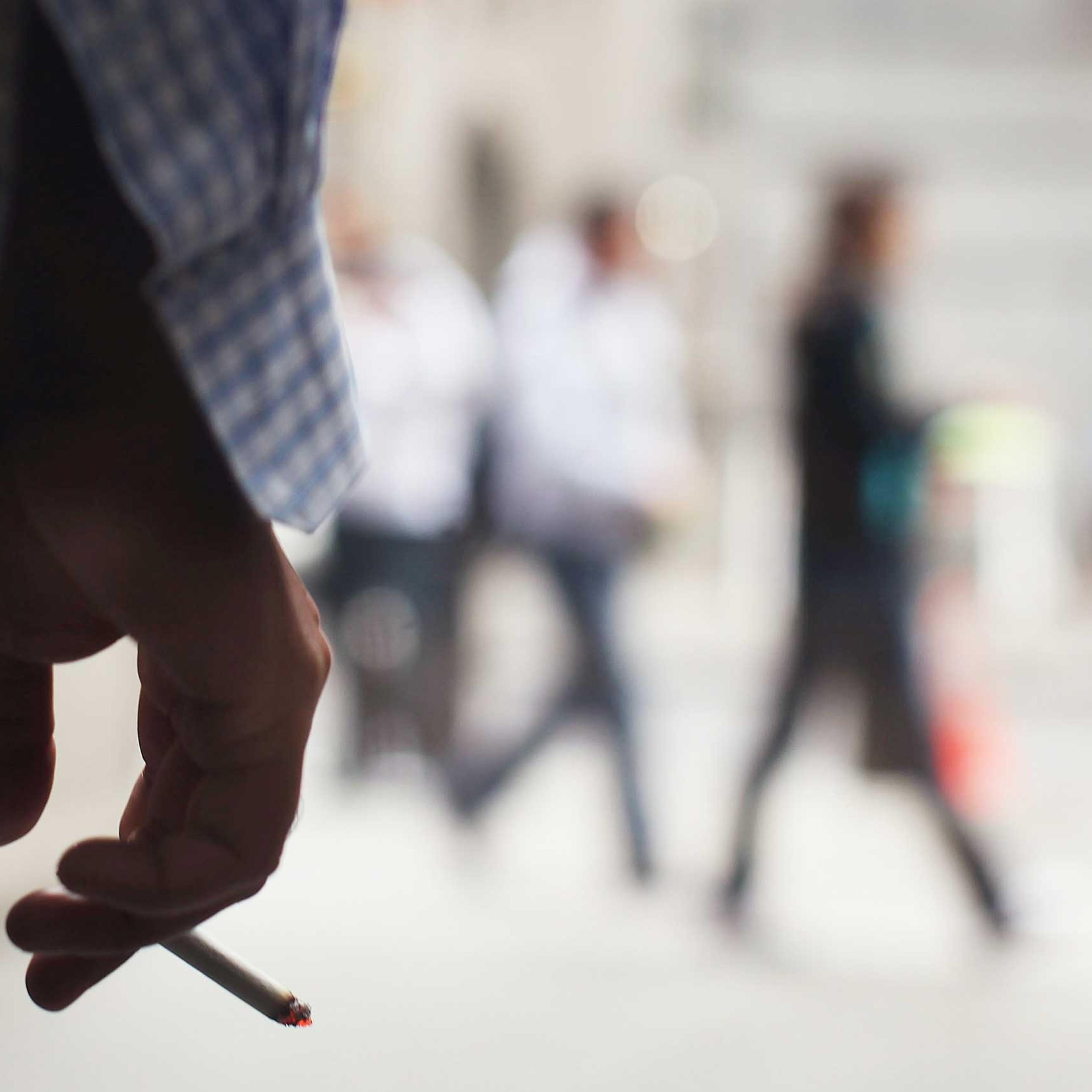 A man smokes outside of a building on June 11, 2009 in New York.