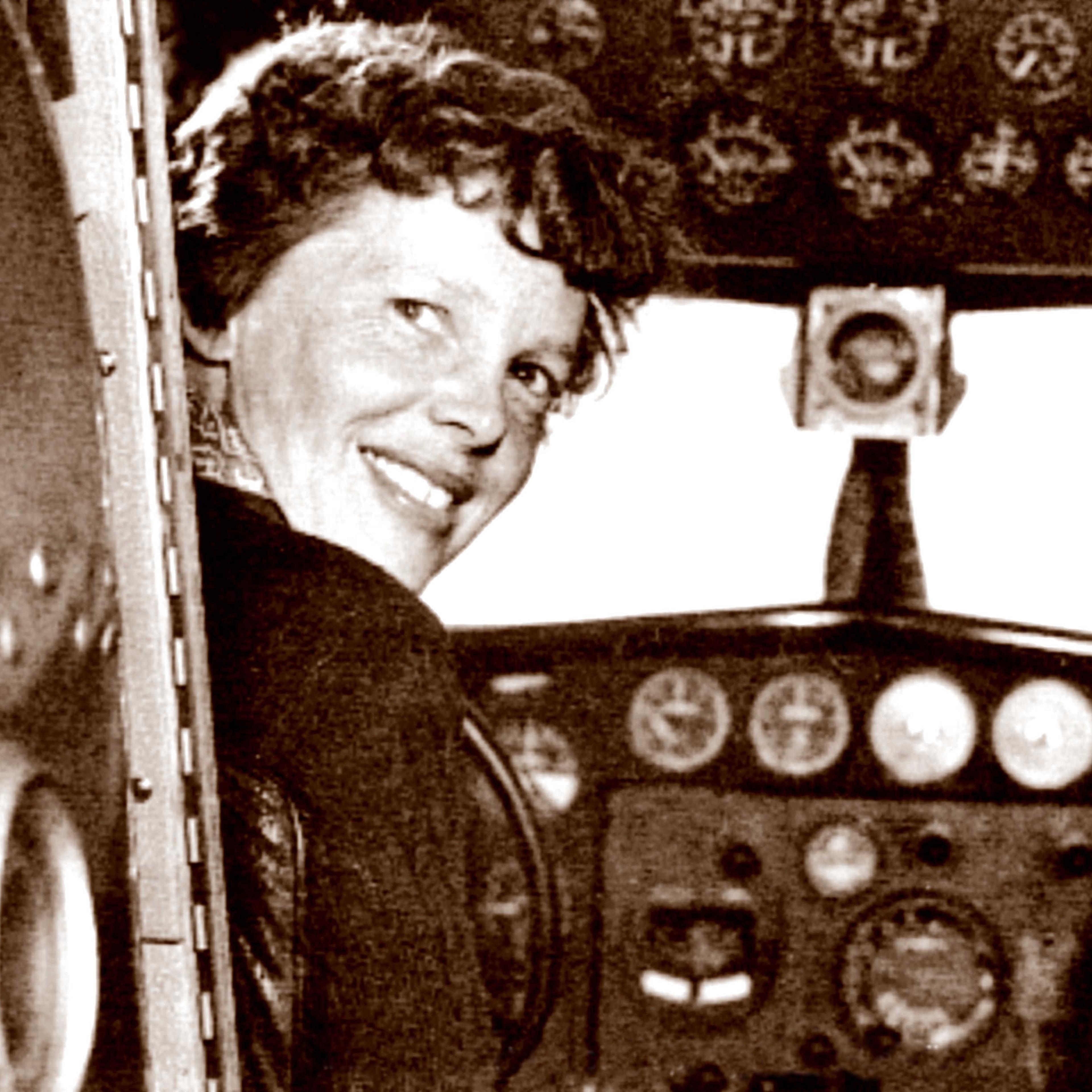 In this May 20, 1937 photo, provided by The Paragon Agency, shows aviator Amelia Earhart at her Electra plane cabin, taken by Albert Bresnik at Burbank Airport in Burbank, Calif.