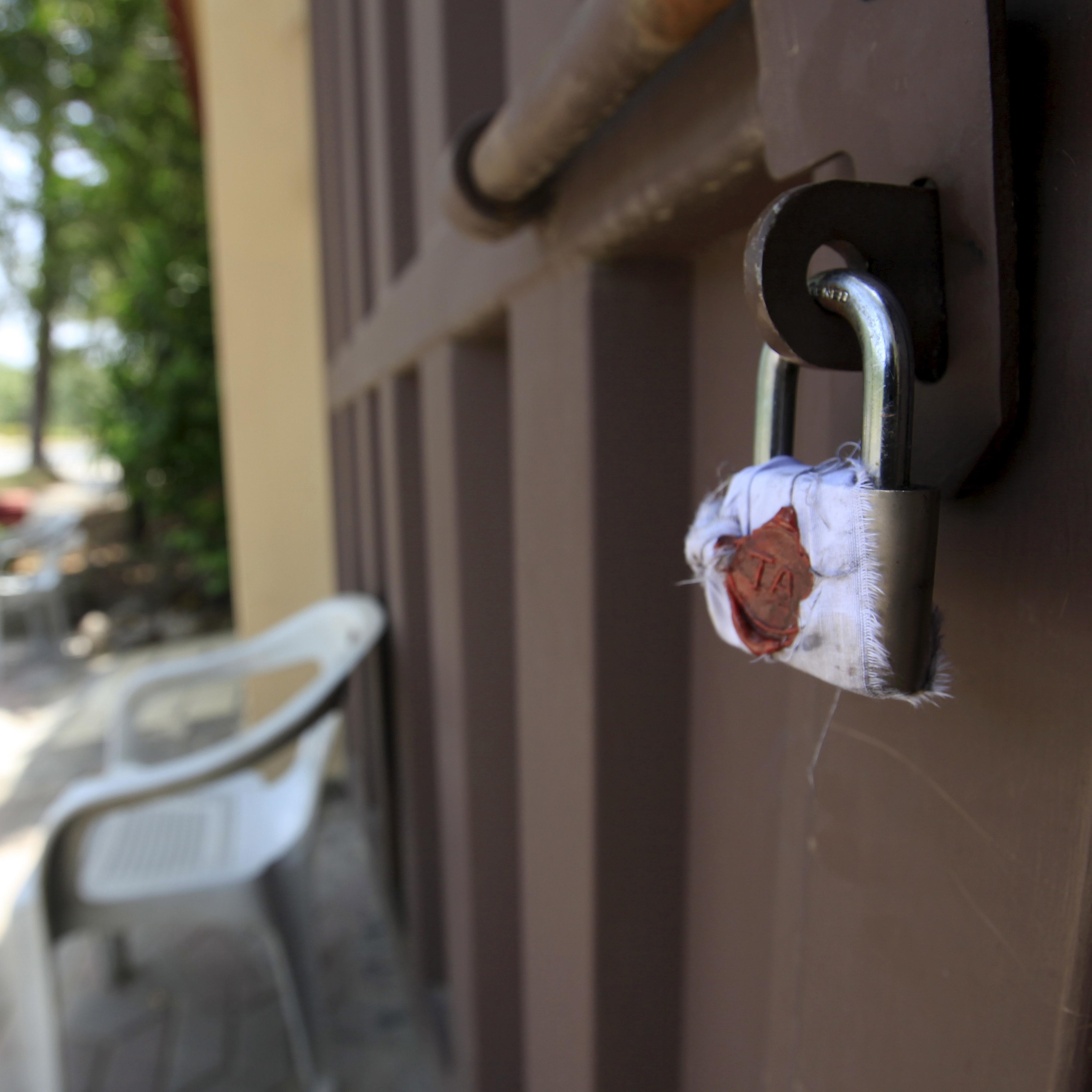 A sealed lock is seen at the gate of Save the Children charity's office in Islamabad