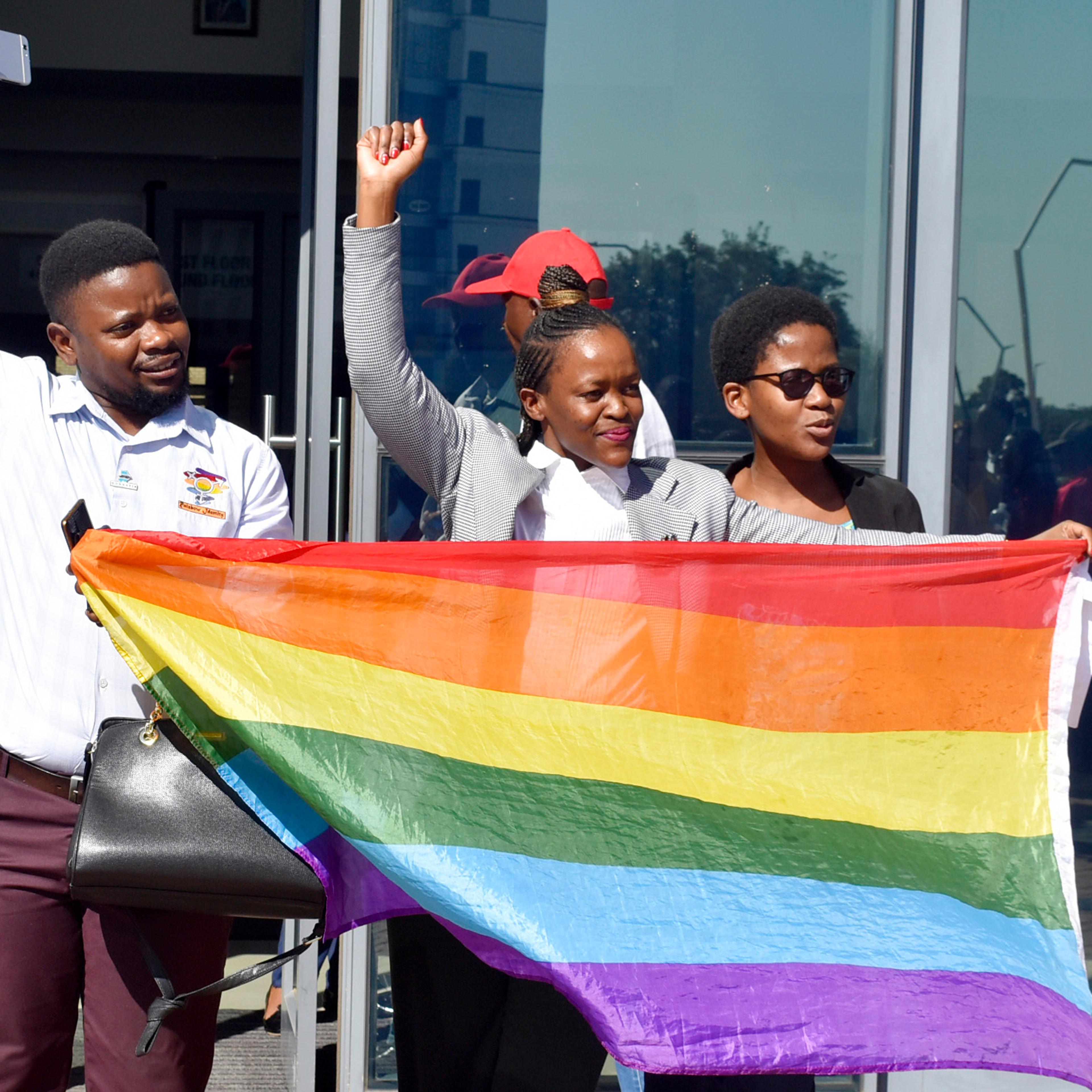 Activists celebrate outside the High Court in Gaborone, Botswana