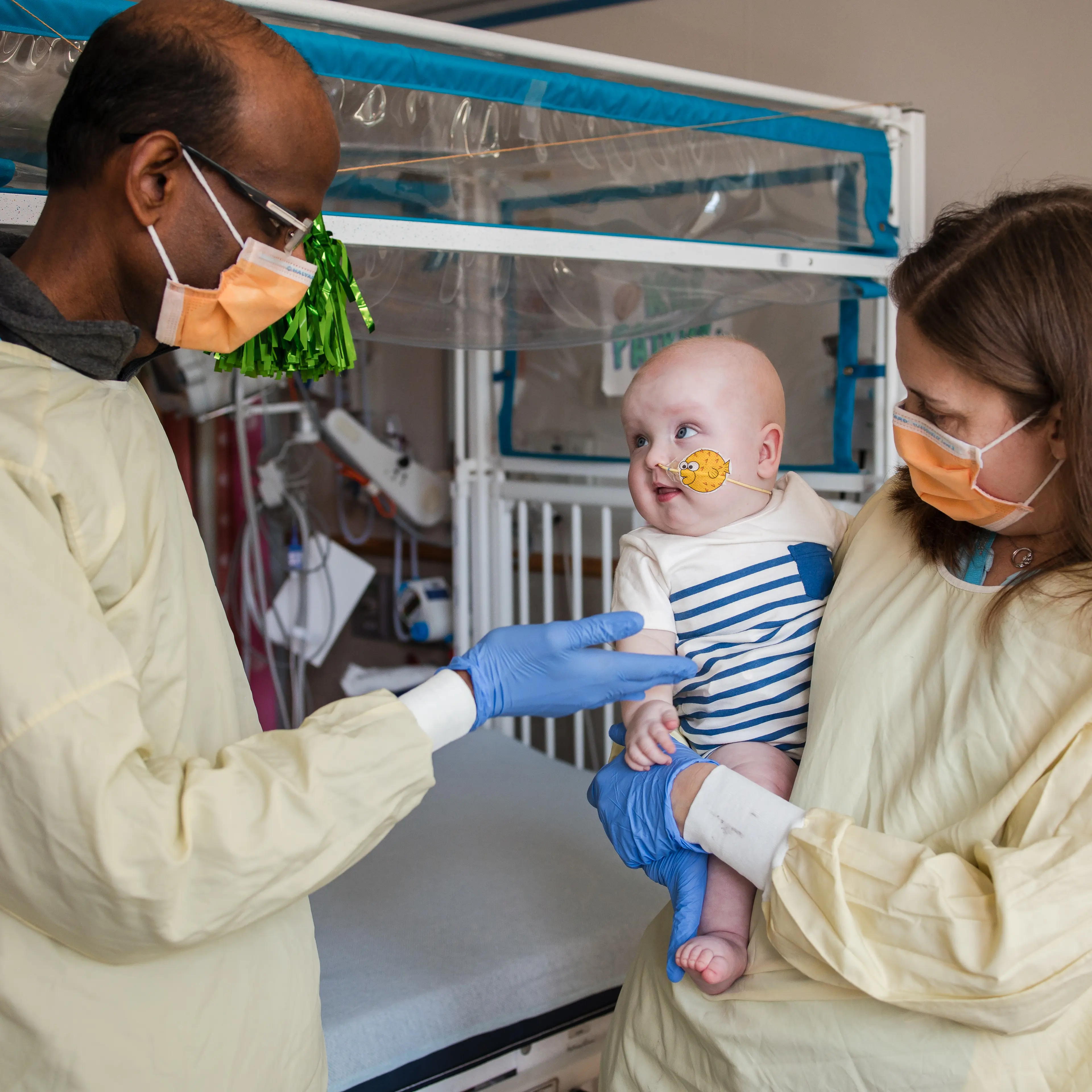 Dr. Musunuru and Dr. Ahrens-Nicklas holding KJ post infusion