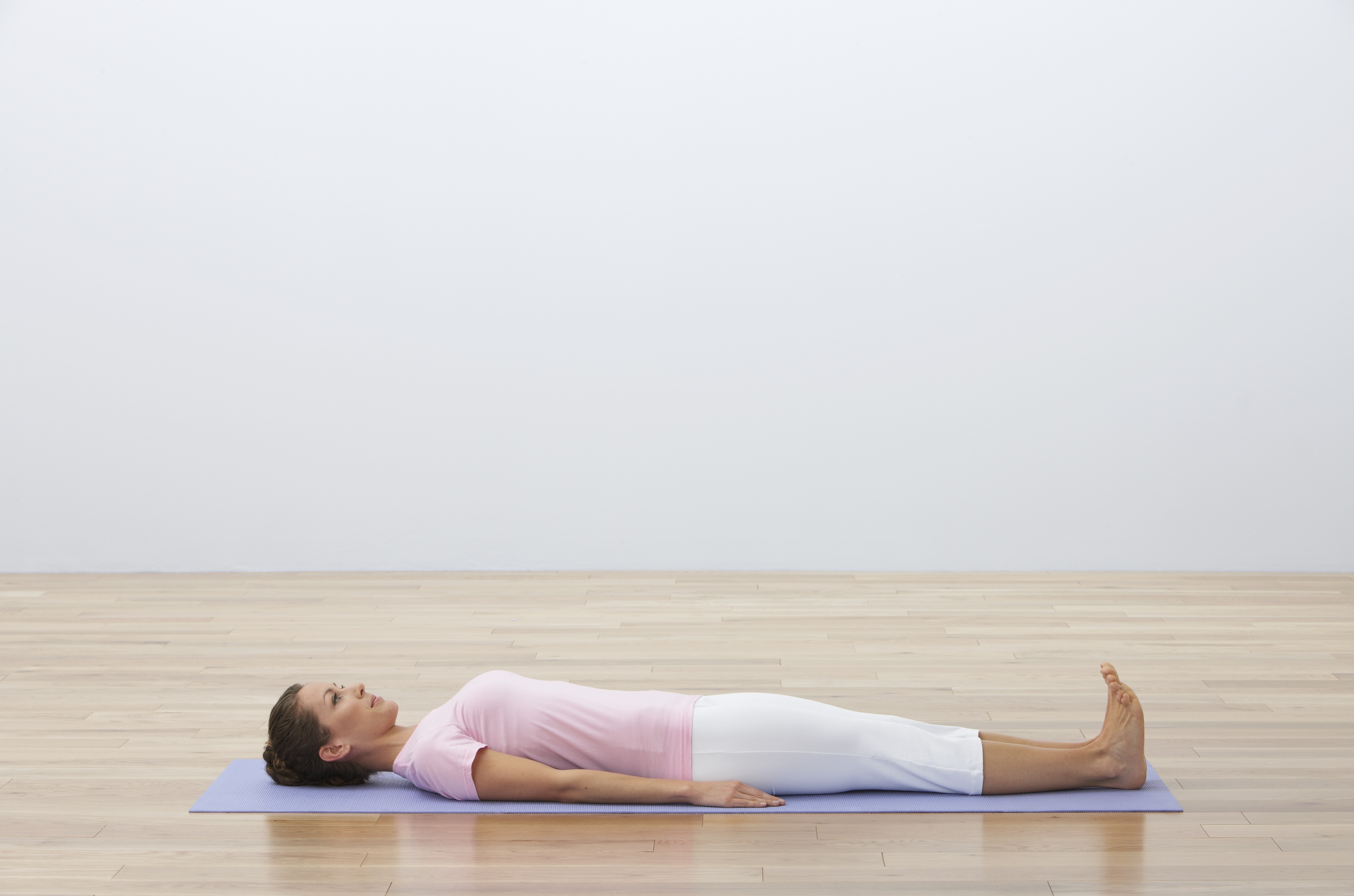 woman-lying-down-yoga-mat