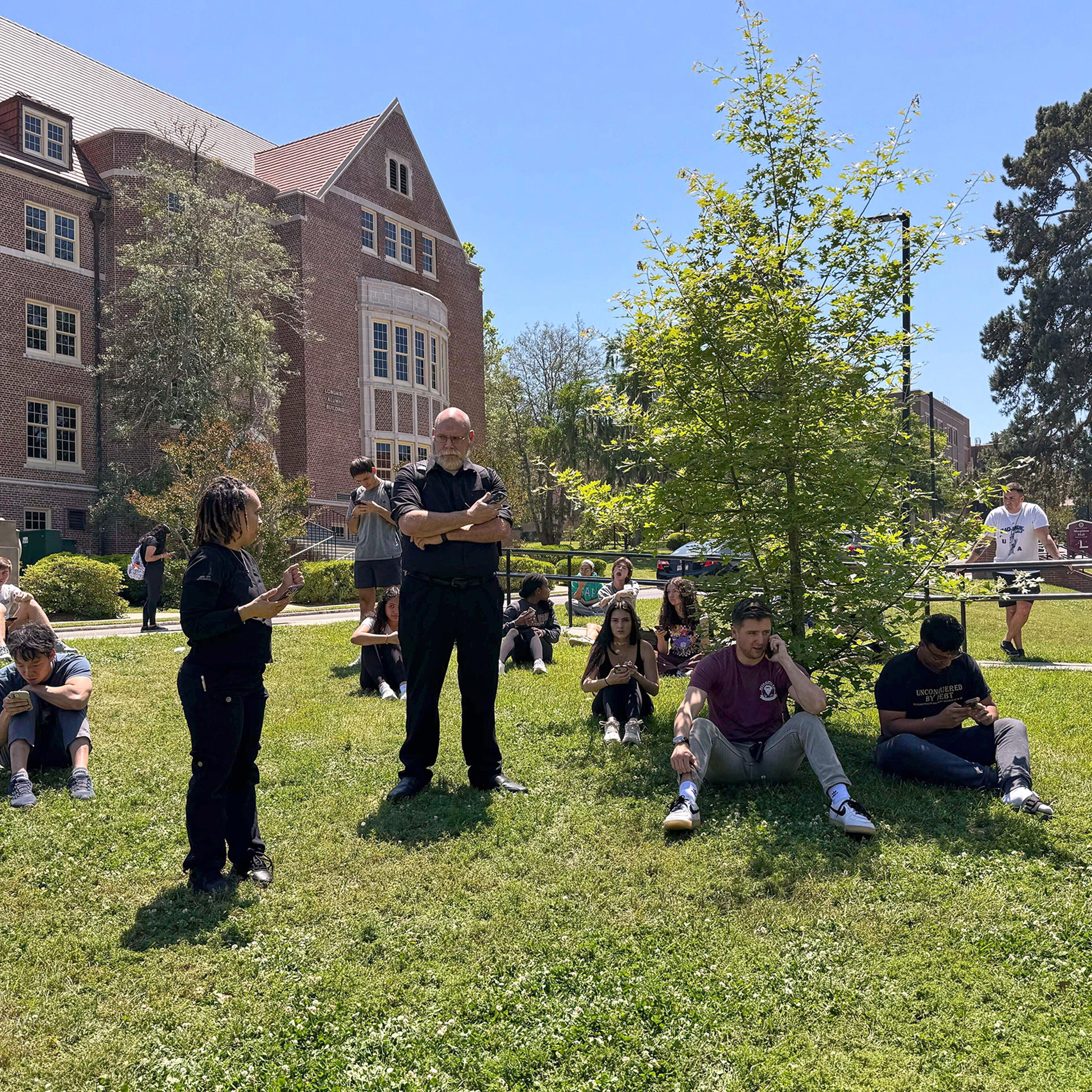 Florida State University students wait for news amid an active shooter incident at the school’s campus in Tallahassee, Fla., Thursday, April 17, 2025.