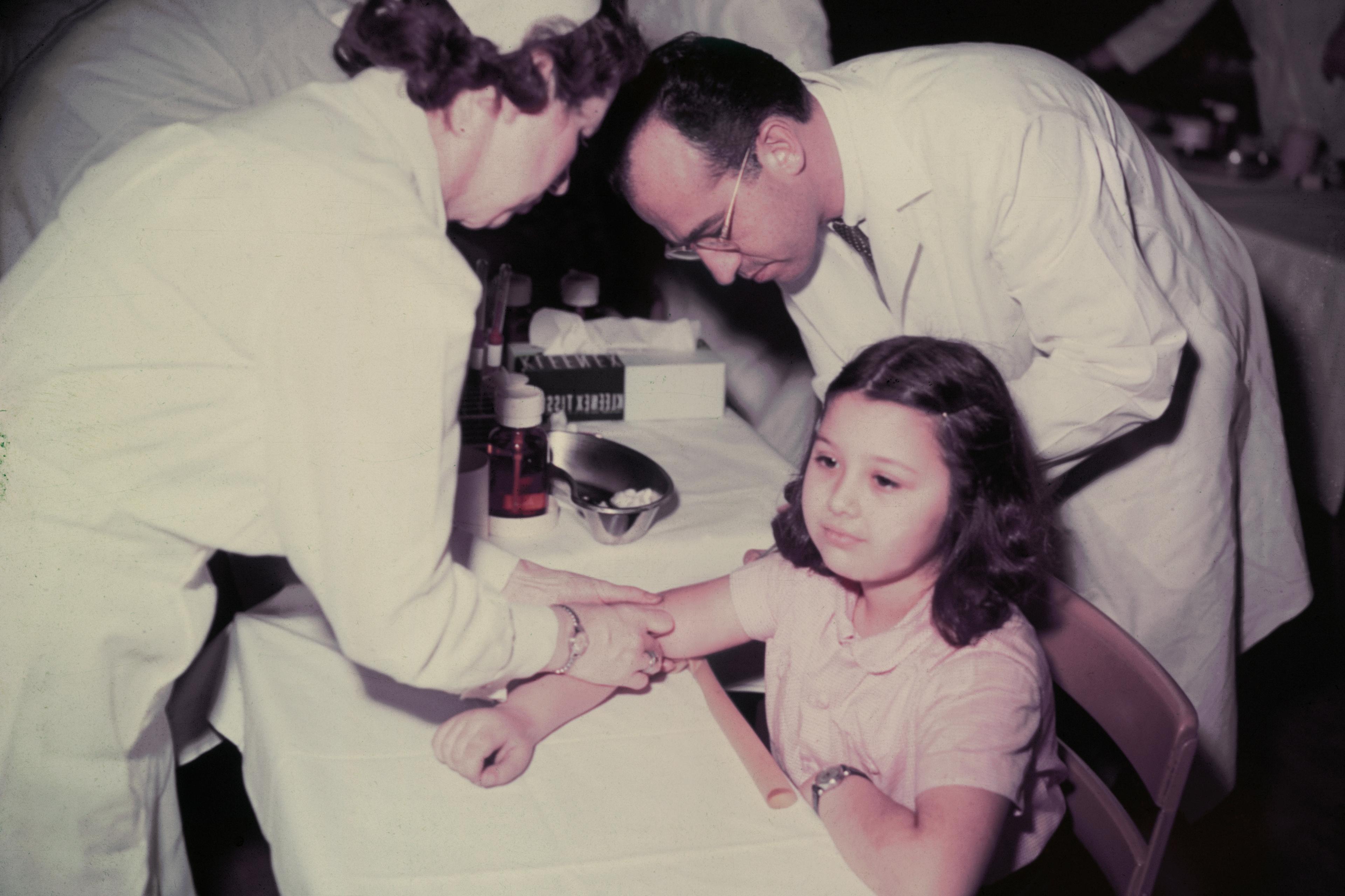 Girl Receiving Polio Vaccine from Jonas Salk