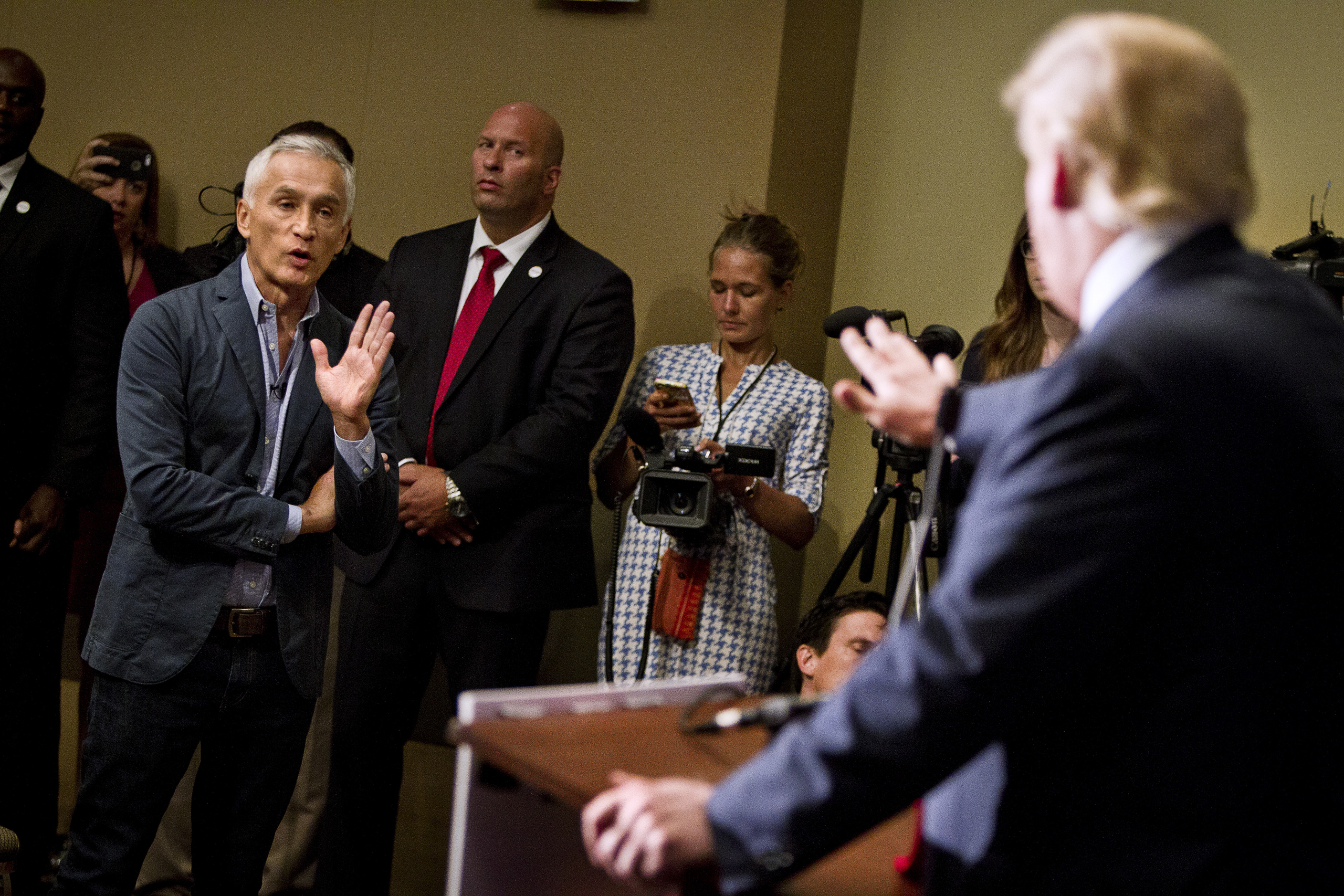 Republican presidential candidate Donald Trump spars with Univision reporter Jorge Ramos before his "Make America Great Again Rally" at the Grand River Center in Dubuque, Iowa, August 25, 2015. Ramos was removed from Trump's news conference on Tuesday af