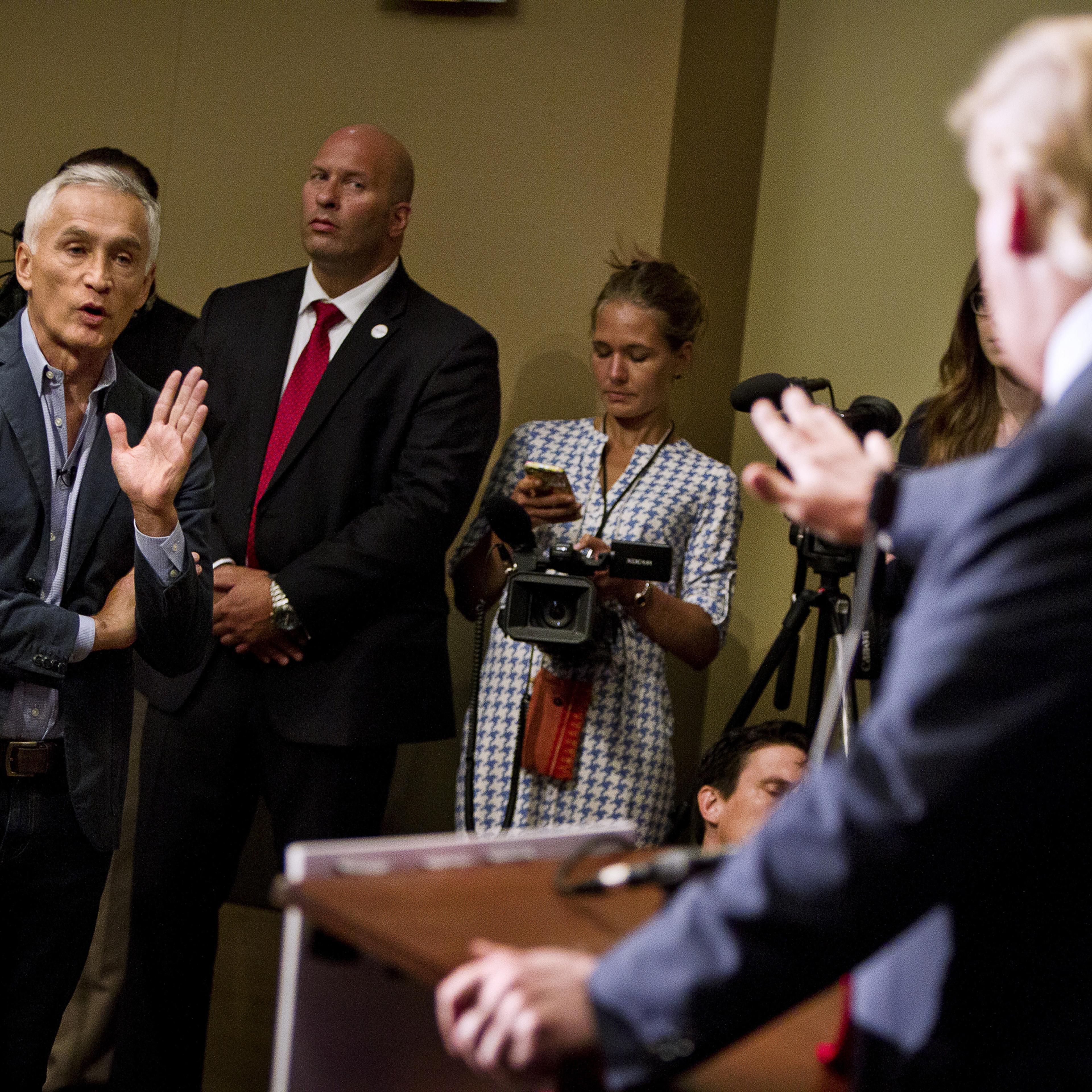 Republican presidential candidate Donald Trump spars with Univision reporter Jorge Ramos before his "Make America Great Again Rally" at the Grand River Center in Dubuque, Iowa, August 25, 2015. Ramos was removed from Trump's news conference on Tuesday af