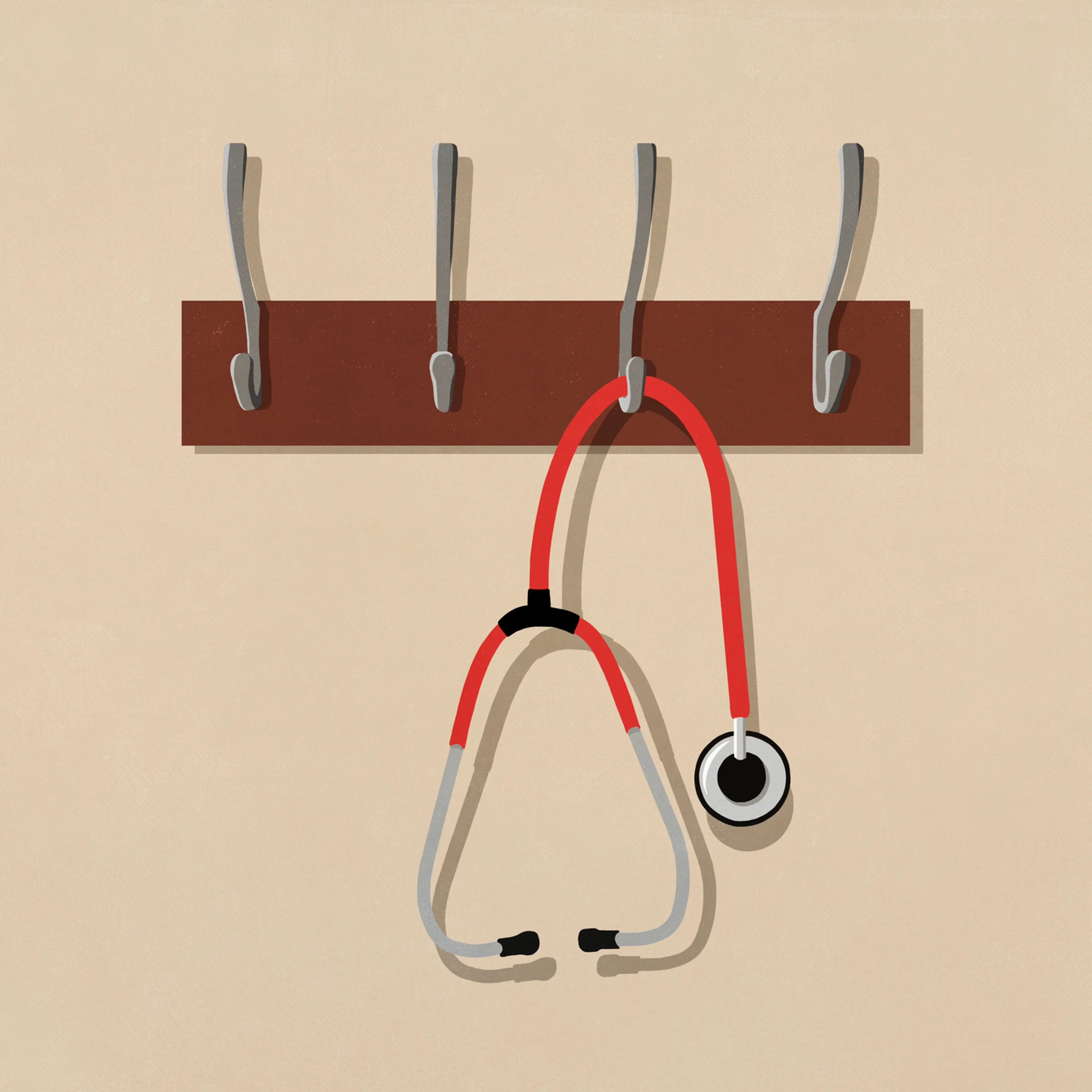 Stethoscope hanging from coat rack