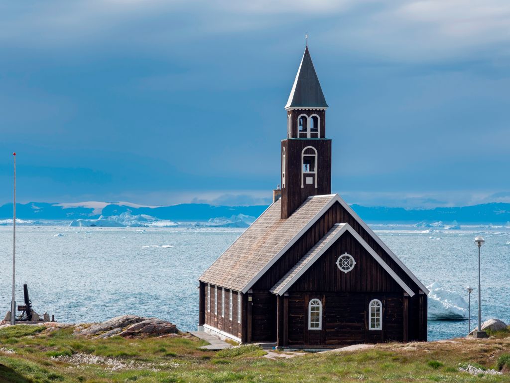 Zions church. Town Ilulissat at the shore of Disko Bay in West Greenland. center for tourism. administration and economy. The icefjord nearby is listed as UNESCO world heritage. America. North America.