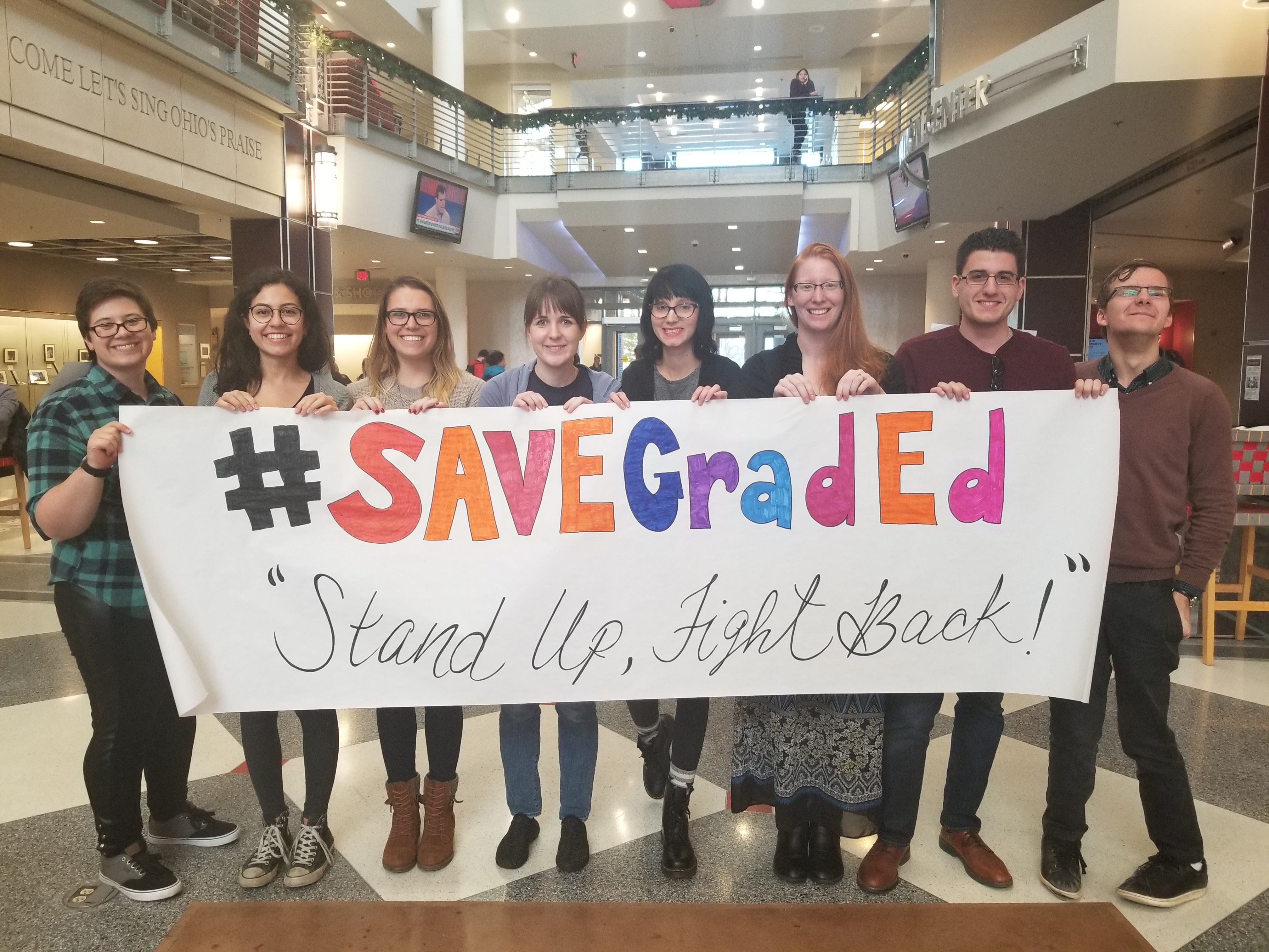 (From left to right)  Graduate students Misha Grifka, Natalia Colon Alvarez, Alison Cummins, Mariah Marsden, Liz Miller, Paige Busby, Yanar Hashlamon and Noah Bukowski protest the GOP tax bill at Ohio State University on Nov. 29, 2017.