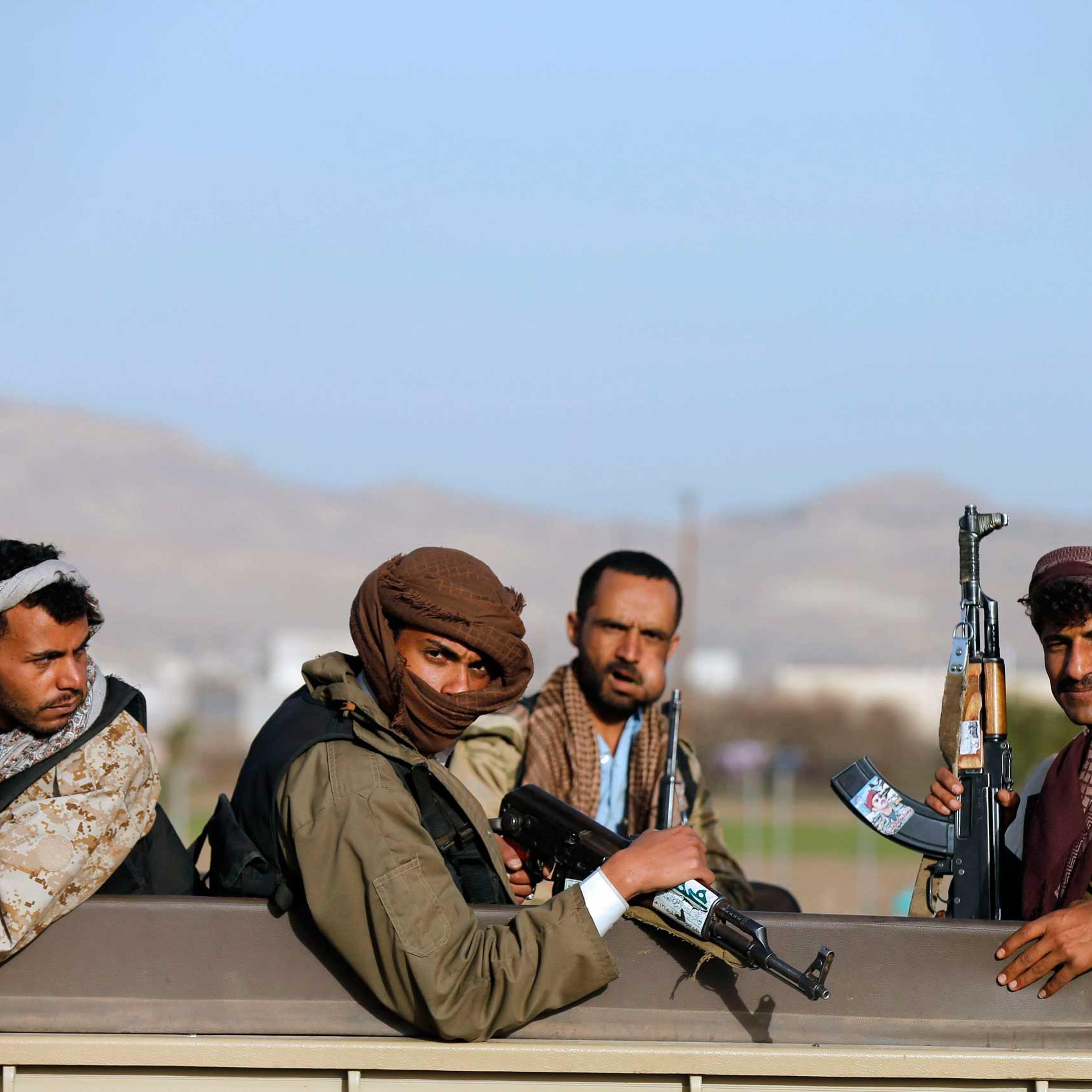 Houthi fighters ride a truck near the presidential palace in Sanaa, Jan. 22. 2015.