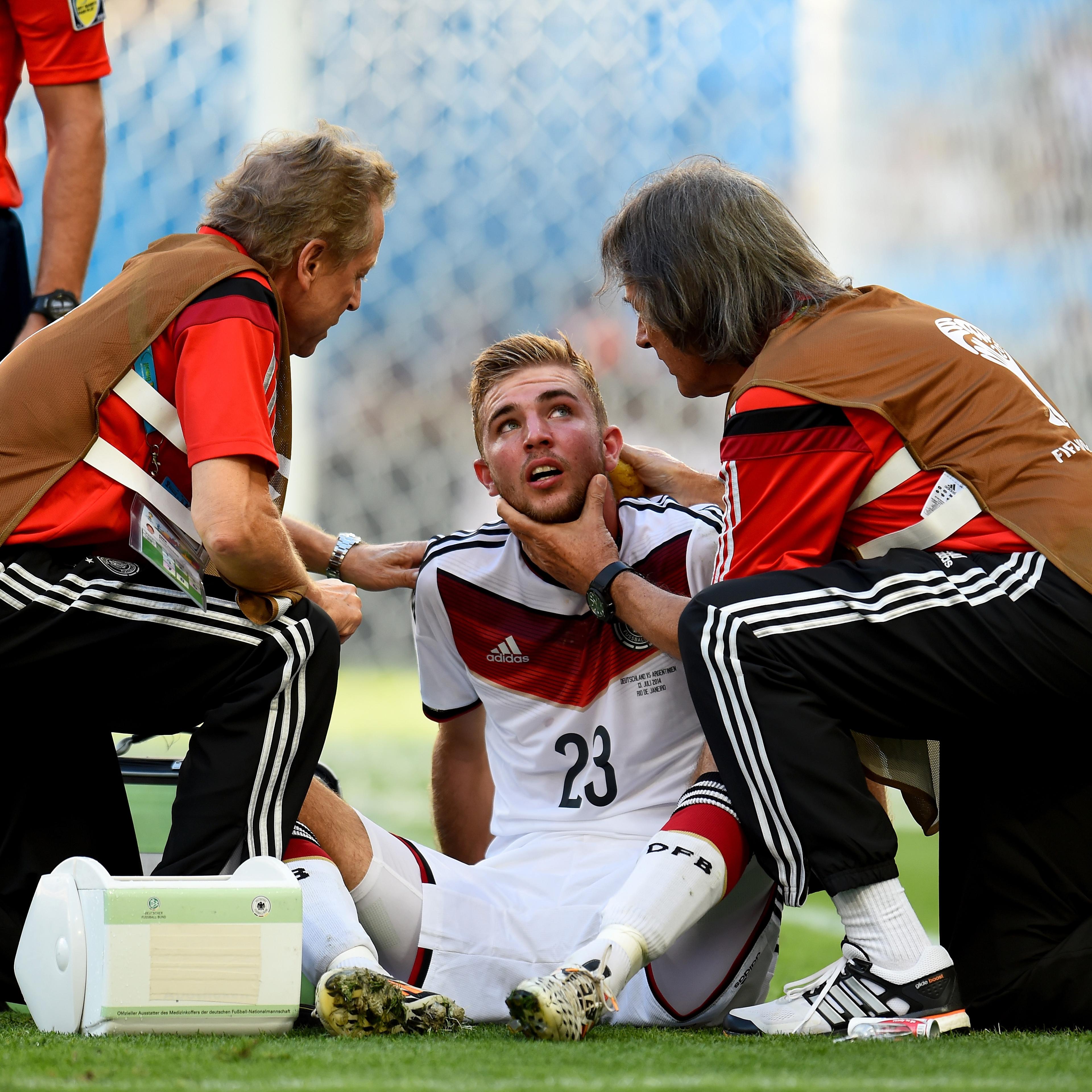 Christoph Kramer of Germany receives a medical treatment during the 2014 FIFA World Cup Brazil Final match between Germany and Argentina on July 13, 2014 in Rio de Janeiro.