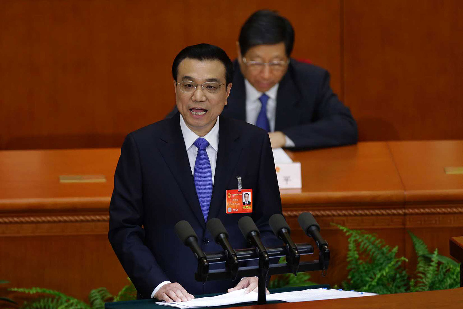 China's Premier Li Keqiang delivers the government work report during the opening ceremony of the National People's Congress (NPC) at the Great Hall of the People in Beijing Mar. 5, 2014